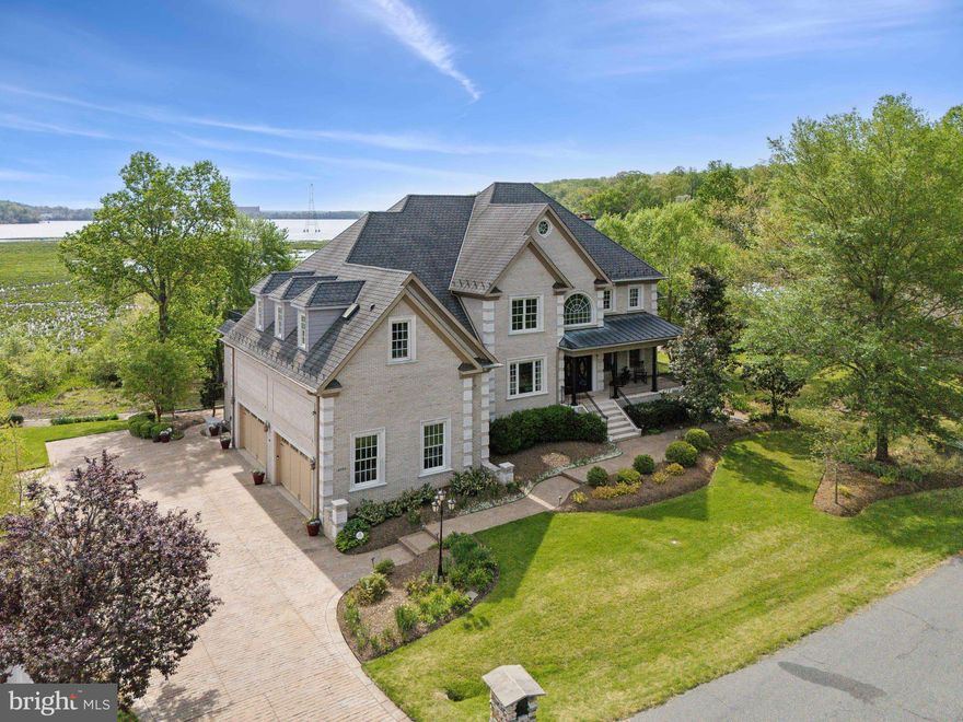 Constructed in 2008 as a home builders residence, 18495 Running Pine Ct was crafted with the highest quality materials and immense attention to detail, offering a truly breathtaking tour room by room.  Step inside to be greeted by the open foyer featuring 18' ceilings and a custom chandelier overhead.  Upon entry, you are met with immediate views of Quantico Creek, a boater, fisherman, and birdwatchers paradise.  

The main level was designed to feature views of the water from all possible angles through the magnificent oversized picture windows throughout.  Newly refinished hardwood floors guide you through the main level starting with the newly renovated kitchen featuring beautiful white quartz countertops, further capturing the daylight.  This chef's dream includes dual wall ovens AND dishwashers, an oversized island-set cooktop, as well as multiple sinks.  Last but not least, a built-in Ariston Italian Espresso machine guarantees the perfect cup of coffee day after day.  Of important note, all appliances are wired and plumbed for both gas and electric supply.  Off of the kitchen, a private study complimented by tray ceilings and a private exterior entrance provides privacy complimented by its own HIDDEN full bathroom.

The living room is the focal point - outfitted with floor to (17') ceiling windows, a 2nd custom chandelier, and a double-sided gas fireplace opening up to the one of the owner's favorite rooms in the house - the reading room - enclosed by even more jaw dropping windows. Finishing off the main level are a formal sitting room and wainscoting-lined dining room as well as a half bath for added convenience.  

Back to the foyer and up the custom iron-railed stairs leads you to 4 spacious bedrooms - 2 of which offering ensuite bathrooms.  The primary bedroom is the pinnacle of this home - featuring two private balconies overlooking the water, multiple skylights, and an expansive walk in closet w/ its own washer/dryer/steamer.  The primary bathroom will make you feel like you are at the daily spa - featuring heated floors, a Turkish steam shower and oversized jacuzzi tub, once again, with water views.  Extra wide hallways and two additional full bathrooms ensure everyone has their own space and privacy while several walk in closets offer endless storage options.

Down to the lower level, hit the remote and watch all of the blinds roll up to let in the unique amount of natural light into this space.  The lower level was designed to offer versatility in your every day life - featuring 3 additional living spaces, a 5th bedroom and 4th full bathroom, a 2nd full gourmet kitchen, a glass doored wine storage room, and last but not least, a professional Brunswick billiards table. Whether you are looking to generate supplemental income from the fully outfitted layout or entertain year round, options are truly endless.  Of important note, the 10' ceilings of the lower level are lined with R15 insulation designed to contain all acoustics and thermal energy. 
A 4-car Italian tiled garage enclosed by 17' ceilings provides safe, secure storage for all of your toys. Outside, a 60+ ft Treks deck outfitted with a gazebo covered dining space offers unparalleled views of the creek. 
Located on a secluded culdesac of the Graham Park Shores neighborhood, enjoy the peace and tranquility of a waterfront lifestyle with the benefits of being minutes from the city.  With the newly built Rose Gaming Resort (7 min.) + Quantico Amtrak Station (12 min.) just down the street and plans in place to develop a waterfront district on the coast of Quantico Creek (just a short boat ride away), location is superb. 

Additional features include multiple washer/dryers (all floors), central vacuum (all floors), x2 walkable attic spaces, x2 tankless water heaters, x3 separately zoned HVAC systems, a 22 Kw Generac gas generator, and so much more... Please refer to documents section for a detailed list of the many upgrades/features of this incredible home...