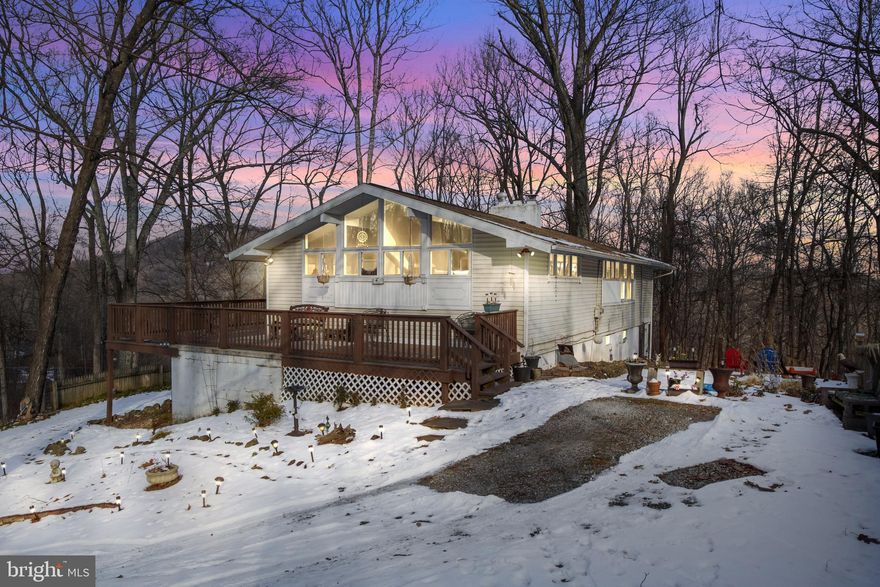 Escape to your own private retreat with this stunning rancher nestled in a wooded setting. This home offers four bedrooms, two full bathrooms, and a spacious layout designed for comfort and versatility. The updated kitchen features modern finishes, while large windows throughout fill the home with an abundance of natural light.

The main level boasts a cozy fireplace, perfect for relaxing evenings, while the finished lower level provides additional living space, including a bonus room and a propane fireplace for added warmth. Step outside onto the expansive wrap-around deck, ideal for outdoor gatherings or enjoying the serene wooded views.

The large driveway offers plenty of parking, and the property’s prime location provides easy access to Route 15 and Ski Liberty.