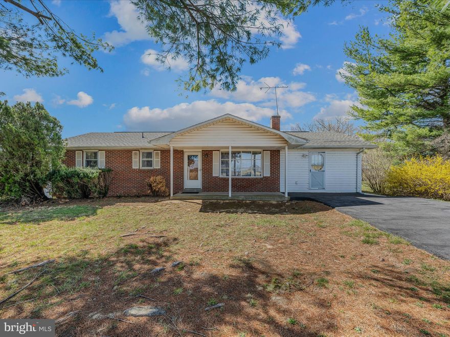 This lovely brick rancher sits of just of an acre of land. Inside the home you have a large living room with hardwood floors and a brick, raised hearth wood burning fireplace. The room includes a wall of windows for tons of natural light. Beyond the living room you have a spacious dining with hardwood floors. The decorative light fixture defines the space. The dining room is open to the kitchen. This is a great set up for entertaining family and friends. The kitchen features a large peninsula island for extra prep and storage space. The raised panel cabinetry is a beautiful cherry. You'll have easy care vinyl floors and laminate countertops. The double bowl stainless steel sink is a great feature. Off the kitchen is the massive family room. Here you have LVP floors and dual ceiling fans. The sliding glass door leads to your rear yard. On the other side of the house, you have the large primary suite with hardwood floors and overhead lighting. The suite features ample closet storage and a private ensuite half bath. Down the hall you have two more generously sized bedrooms with hardwood floors, overhead lighting, and lots of closet space. The main bath features vinyl floor, single bowl vanity, and 5 ft porcelain tub with tile surround. On the lower level you have a large unfinished area that would be great for storage. You have a door that walks out to the rear yard. Your laundry area is in this space and features a double bowl utility space. The lower level also includes a large, finished rec room. It features carpet and built-ins with space for a large TV. There are also two large closets for extra storage. The lower-level bathroom features a 3 ft acrylic shower and single bowl vanity. Outside the home you have your extensive backyard. The yard is lush with grass and trees and mostly level. The acre lot provides privacy from your neighbors and plenty of space for activities. The two car detached garage measure 28 ft x 28 ft. It features two garage doors with automative openers and a personal entry door in the rear. Inside you have three windows, concrete floor with a drain, overhead lighting, and electric outlets. This would be great for car storage or a workshop. This home has everything you've been looking for a more. Schedule your showing today!