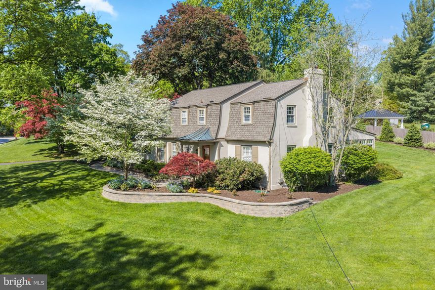 Welcome to 977 Ivycroft Road—where privacy, convenience, and timeless style come together in a beautifully updated two-story Colonial. This home blends classic charm with modern upgrades, offering a warm and inviting layout designed for both everyday living and entertaining.
Step into a gracious center hall that opens to a main level with seamless circular flow. The spacious living room and formal dining room provide elegant gathering spaces, while the chef’s kitchen serves as the true heart of the home. Thoughtfully designed, it features a Viking Professional range, Sub-Zero refrigerator, Bosch dishwasher, custom cabinetry, a large island, and exceptional storage solutions.
The kitchen flows effortlessly into the family room, ensuring you’re always part of the action. A stunning breakfast area with vaulted ceilings, skylight, and a wall of windows fills the space with natural light by day and offers peaceful nighttime views. Just beyond, an extraordinary sunroom provides the perfect spot to enjoy your morning coffee. The home’s layout creates a wonderful indoor-outdoor connection, ideal for both large-scale entertaining and relaxed daily living. Hardwood floors extend throughout the main and second levels. 
Upstairs, you’ll find a spacious primary suite along with three additional bedrooms. The primary retreat features two walk-in closets with custom organization systems and a beautifully updated bath with an oversized shower. There is plenty of closet space and a spacious updated hall bath. A large walk-up attic provides abundant additional storage.
The lower level is designed for entertaining, complete with a custom kitchenette, refrigerator, island, and built-in cabinetry- making it perfect for hosting guests or creating a comfortable recreational space.
Back to the main level, at the rear of the home, the attached garage, main-floor laundry, and spacious mudroom with custom built-ins enhance everyday convenience, organization, and ease of access.
Outside, a large flagstone patio serves as a natural extension of the home, easily accessible from the kitchen, breakfast area, and sunroom. The thoughtfully designed gardens and hardscaping reflect careful planning and pride of ownership, creating a beautiful and functional outdoor retreat. 
Enjoy peace of mind with a brand-new roof and energy-efficient natural gas HVAC system, both installed in Fall 2025. 
Perfectly situated on a quiet street just moments from downtown Wayne, transportation, exceptional dining and shopping, and major highways…977 Ivycroft Road is truly an unbeatable Main Line location.