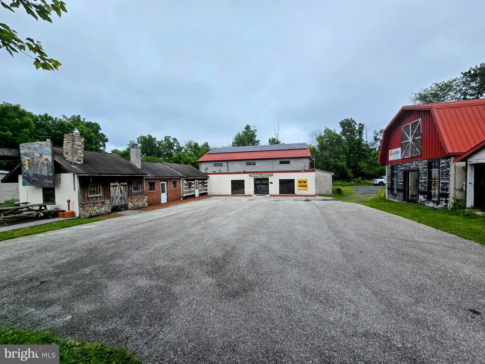 4.25 acres with public sewer, 4 houses and 5,326 square feet of retail and warehouse space. Property is located on Route 30, 1 mile East of the Route 15 and Route 30 interchange. Economic Development - Commercial District (EC-1) zoning allows for many uses. Property corners on Route 30 and Flickinger Road with 602 feet of road frontage on Route 30 and 278 feet on Flickinger Road. 1936, 1988 and store front generate $4,550 in monthly rental income. Units could easily produce $9,500 in their current condition. 1940, 1954 and warehouse are owner occupied.