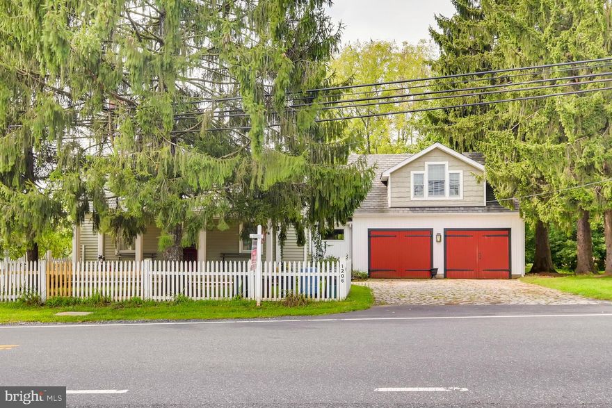 The original building was thought to be built in the late 1700's to early 1800's .  The home has been updated and maintained to keep the original character and charm of an 1800's farm house.  There aren't many left and the rarely come up for sale .  There is a new modern master suite with a private balcony over the garage, with an additional 3 huge bedrooms on the second floor.  The main entrance and the main floor are all original hardwood the stairs are the original hand carver banister.  There is so much history in this home.  Two large living areas on the the first floor and the large kitchen had the original beans in the ceiling and a potbelly stove.There is a   1/2 bath off the kitchen in a hall that leads to the patio.   Attached garage with work bench. In the back there is a large 2 story building that is used for crab feasts in the rain, or would make a fantastic play house or storage.     Huge yard partially fenced and the remains of the stone foundation of the original barn.  If you want an old home this is it great location and a beautiful home.