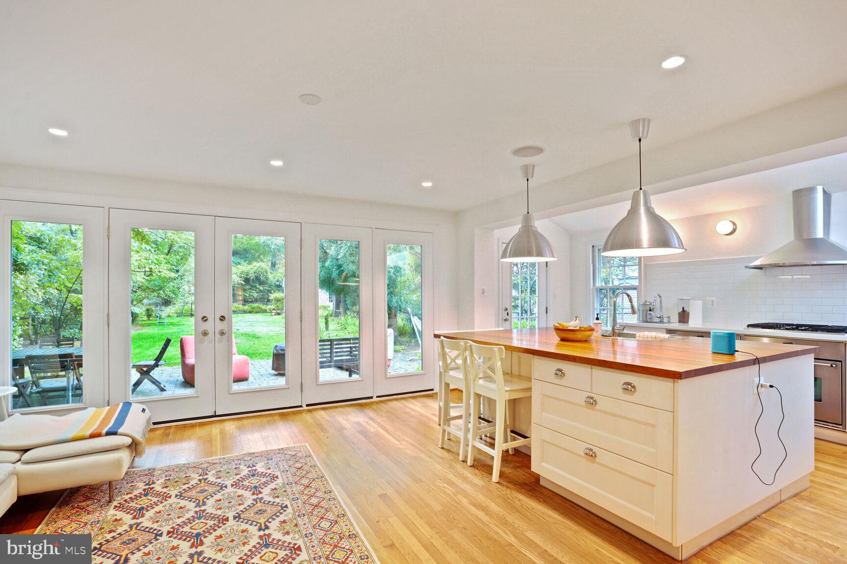Welcome to this brick colonial home with a modern twist situated in the coveted Village of Martin’s Additions of Chevy Chase, MD! As you drive to the end of a quiet cul-de-sac and enter the home, you will be met by sunlight streaming into 3,300 finished square feet. The main level contains a delightful living room, formal dining room, and handy study. The showstopper is the back portion of the home which includes a stunning chef’s kitchen with top of the line appliances, cherry wood island, two ovens, two dishwashers, a large pantry, and skylights. The kitchen opens directly to a spacious family room with french doors to the patio and yard. A convenient mudroom and powder room round out this level.
Retreat to the upper floor where you will find a primary suite with a dressing area and full renovated bathroom, with ample closet and storage space. A full hall bath and 4 additional light-filled bedrooms finish this level. The lower level consists of an expansive recreation room, an additional full bath, another office/bonus room, laundry room, and a huge storage room. Step outside to the jaw-dropping 12,700 square foot yard, which includes a flagstone patio, enormous lawn, and another surprise - a finished cottage space. That’s right - there are 3 additional flex spaces in this property that can be used as an office or for other needs.
This property is nestled in a prime location - just north of DC, close to bustling downtown Bethesda - near Brookville Market, the farmer’s market, and restaurants such as La Ferme, Little Beast, Bread & Chocolate, and Macon Bistro. Public schools include Rosemary Hills (PK-2nd grade), Chevy Chase Elementary (3rd-5th grade), Silver Creek Middle School, and Bethesda-Chevy Chase High School. Excellent recreation is available at nearby Rock Creek Park and on the extensive cycling trails. Welcome home!