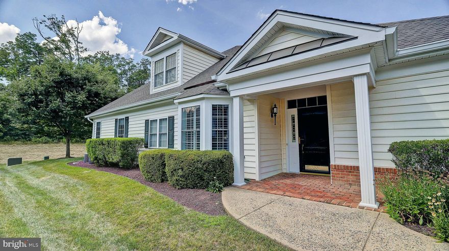 This Winfield model is located in the Regency at Dominion Valley Country Club, a 55+ active adult  community. This beautifully maintained luxury end unit  carriage home boasts over 2,600 square feet and features hardwood floors in the living, dining and foyer. The large kitchen features granite countertops, stainless-steel appliances and a pantry. The kitchen overlooks the breakfast area and family room which leads to a private screened in porch perfect for your morning coffee and nature watching. A brick paver patio in the backyard is ideal for entertaining. The main level master bedroom has a tray ceiling, crown molding, a ceiling fan, and wonderful natural lighting in the afternoon. The master bathroom features a double sink vanity, soaking tub, separate ceramic tiled shower with bench, natural lighting provided by a nice sized window, and a plentiful walk-in closet. Off of the foyer is the second bedroom with crown molding that could also work well as an office or den with the hall bath and linen closet located nearby. Upstairs you will discover an abundant loft area and a full bathroom, as well as a bedroom with sitting area and a large walk-in closet. HOA fee includes lawn maintenance & landscaping, irrigation system, trash & snow removal, roof and driveway replacements, and Comcast Internet & cable TV service. A Capital Contribution of $1,738.24 and Social Membership Initiation fee of $1,000 is paid by buyer at settlement. The Social Membership due of $46 per month includes all the amenities the clubhouse has to offer: indoor & outdoor pools, tennis, library, fitness, party, craft & billiards rooms, and so much more. Golf Memberships available.