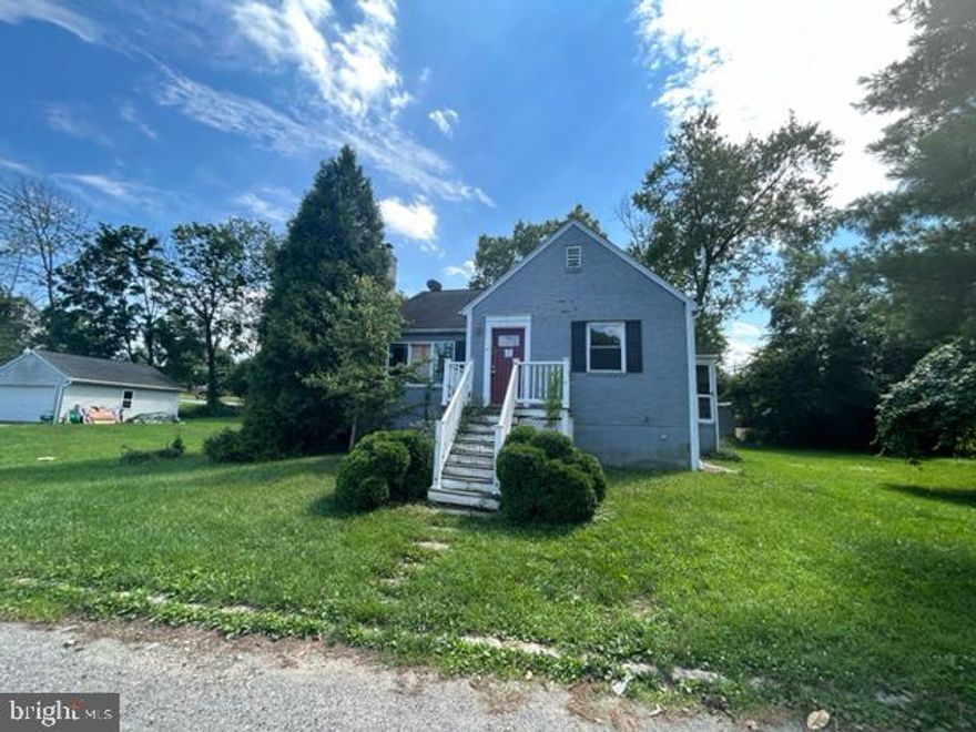 This home is sold "AS IS." This is a Fixer Upper suited for someone looking to renovate. Great location and great lot.  Home is situated on nearly half an acre w/Open Concept Layout.  Hardwoood floors throughout, with a fireplace in the living room.   Ample Cabinetry in the kitchen .  4 bedroom and 2 baths.    Buyer is responsible for turning water on and off for inspections.  Seller will make no repairs.  Home is being sold w/additional lot, bringing the lot size to approx 0.45 acre!