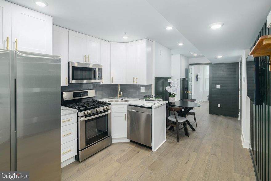 Discover comfortable city living in this inviting 2-bedroom, 1-bathroom unit located in the heart of Port Richmond, one of Philadelphia's most desirable neighborhoods. The modern kitchen is fully equipped with stainless steel appliances, including a dishwasher, and sleek quartz countertops, perfect for culinary enthusiasts. Convenience meets style with an in-unit washer and dryer, as well as a tastefully designed bathroom featuring a tub and a tiled surround. Accent walls add a touch of character throughout the space. Located directly across from Reanimator Coffee, this unit offers an ideal blend of modern amenities and a prime location, with easy access to all that Port Richmond has to offer.