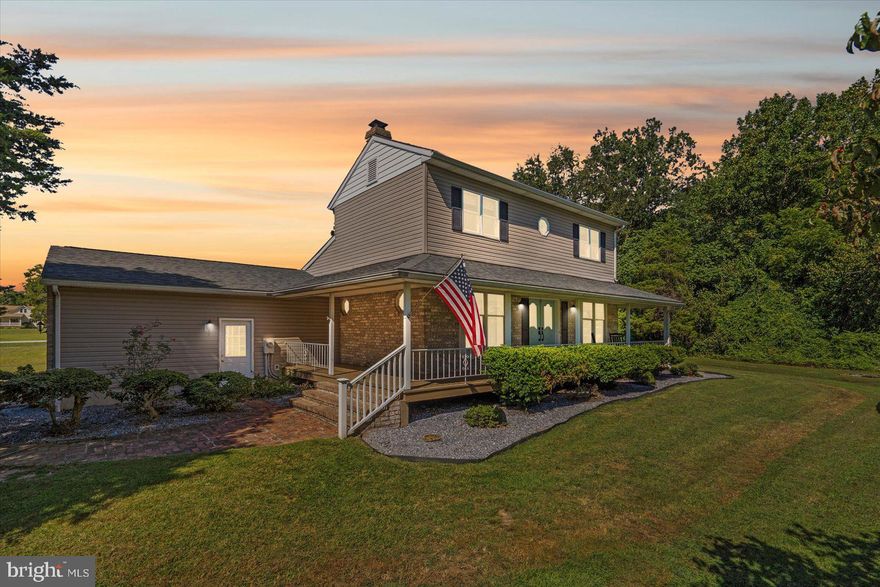 Opportunities like this are rare. This elegant, historic colonial in the coveted Bird River Beach community sits on nearly 2 acres of private tree-lined grounds with sweeping pasture views, just steps from Bird River.

A southern-style wrap-around porch leads through french doors into a dramatic foyer with a classic 1800s staircase. Inside are 4 fireplaces, formal living and sitting rooms, and an updated kitchen with granite counters, newer stainless steel appliances, rich cabinetry, and a breakfast bar. The showpiece is a dining and sitting area believed to date back to the 1600s, featuring preserved log cabin-style walls, exposed beams, and a stone fireplace.

The main level also offers a full bath, 4th bedroom/office, laundry/storage room, and access to the oversized two-car garage. Upstairs, the spacious primary suite includes a walk-in closet and electric fireplace, with two additional large bedrooms and another full bath with updated shower and fixtures.

Outdoors, enjoy a stone patio, covered BBQ pergola, playground, and storage shed, all surrounded by nearly 2 acres of private land. Owners can opt into community benefits including a private boat ramp, clubhouse, and playground.

This home is more than a residence—it’s a piece of history in one of the area’s most desirable communities. Updates include a modern electric system, whole-home water filtration, dual-zoned HVAC with UV system, septic updates, new front siding, LVP flooring, and more. Conveniently located near major commuter routes, Richardson Farms, dining, and shopping.