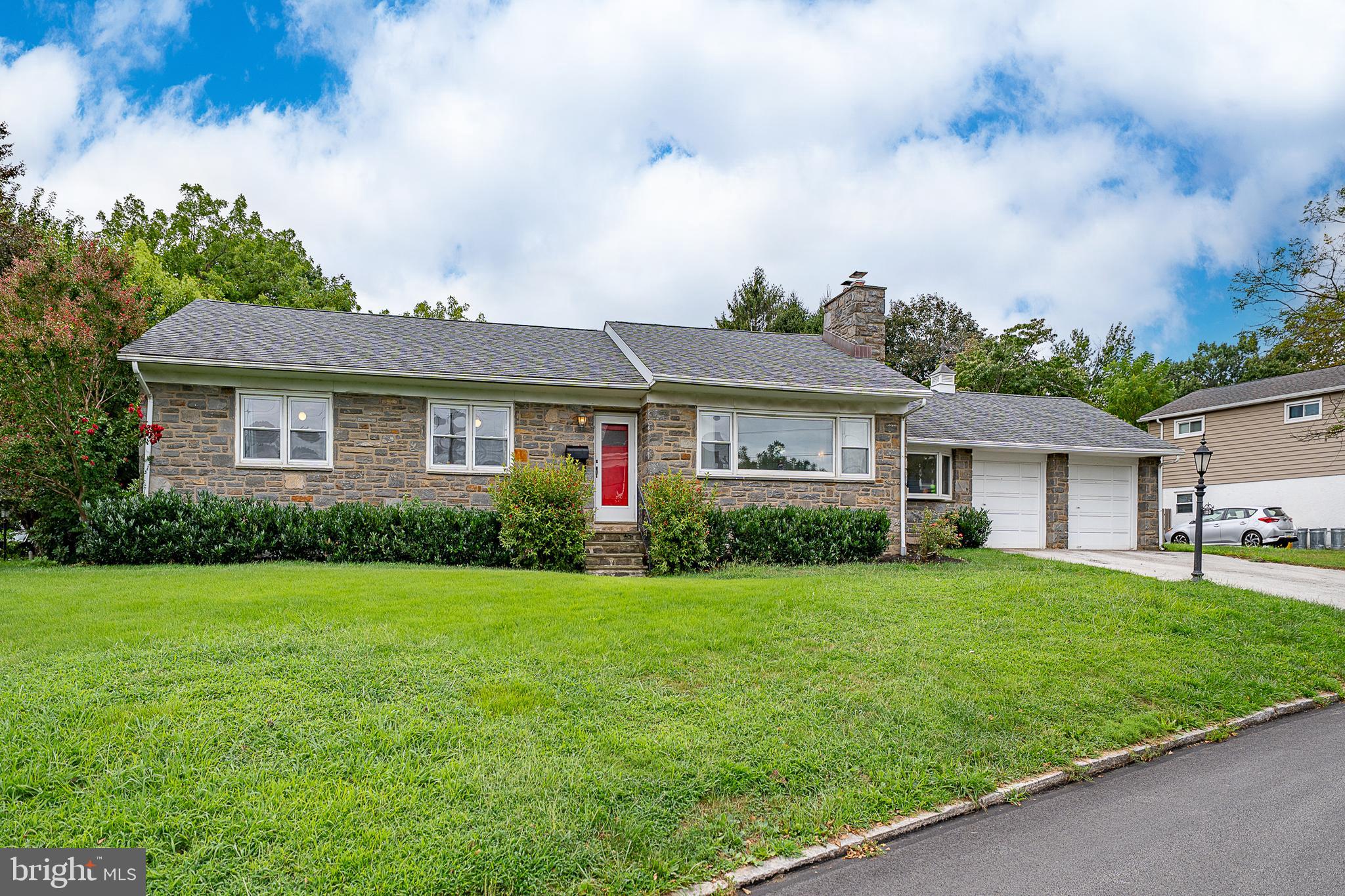 Welcome to this spacious 3-bedroom, 3-bathroom rancher in the desirable Belmont Hills neighborhood of Lower Merion. A bright and inviting living room with hardwood floors and a gas fireplace flows seamlessly into the formal dining room—perfect for gatherings. The cozy family room is filled with natural light and features a striking exposed stone wall. The large eat-in kitchen overlooks the backyard and offers granite countertops, newer stainless steel appliances, and plenty of workspace. Down the hall, the primary suite boasts a generous closet and a private ensuite bath. Two additional bedrooms and a full hall bathroom complete the main level. The expansive walkout lower level provides an additional 1,800 square feet of open living space, ideal for recreation, play, or a guest suite. This level includes LVP flooring, a bar area, a full bath, a cedar closet, and a laundry. Set on a corner lot with a fenced-in backyard, this home also features an attached 2-car garage. Enjoy the convenience of one-level living with easy access and a walk to the elementary school, library, playground, township pool, and the shops and restaurants of Manayunk. A quick commute to Center City and Conshohocken makes this location truly ideal. Schedule your showing today!