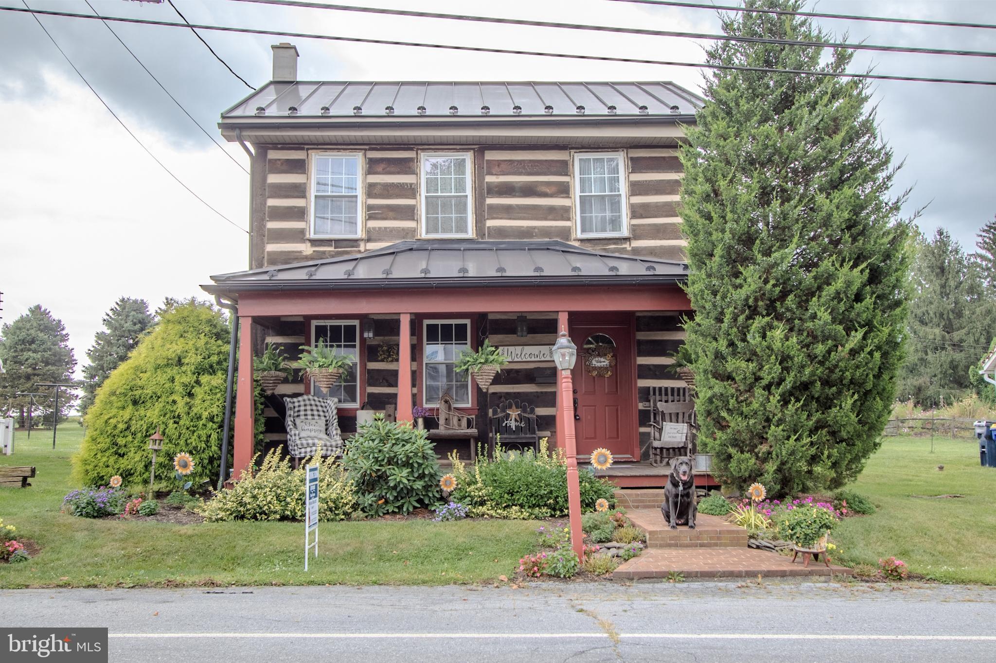Step back in time and experience the character of this one-of-a-kind colonial log home.
The main level offers a welcoming country kitchen and dining area, a spacious living room perfect for cozy gatherings, with gas hook up for fireplace. A large first-floor laundry with built-in storage and direct outdoor access adds convenience and functionality.
Upstairs, you’ll find two inviting bedrooms, including one with a walk-in closet, along with a updated full bath.
Enjoy the outdoors with a generous fenced in backyard, a large shed with plenty of storage and work area, a detached one-car garage, and off-street parking for two additional vehicles.
Don’t miss the chance to own a piece of history with modern comfort.