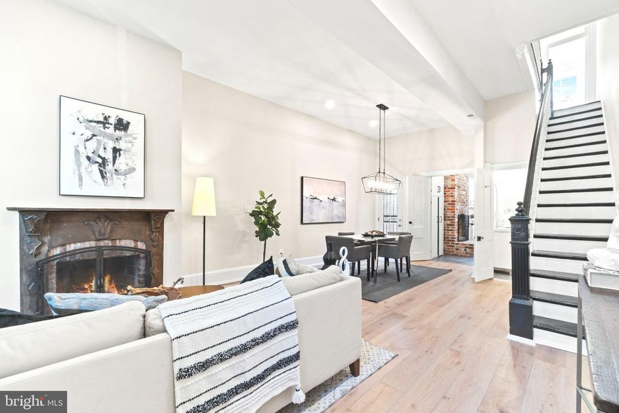 You don't want to miss this CAP HILL CHARMER WITH PRIVATE OUTDOOR SPACE! This 3BR semi-detached brick rowhome is perfectly situated in one of DC's most historic and prestigious neighborhoods. You'll love the nice curb appeal, stained glass window, and welcoming foyer as you enter the home. The main level was just updated to feature an OPEN FLOOR PLAN with a spacious living and dining space, working fireplace, and powder room. Enjoy the hardwood floors throughout and recently updated Porcelanosa tile flooring in the kitchen, entryway, and powder room. The kitchen features a large pantry, black stainless appliances, marble countertops, and white cabinets. Off the kitchen is access to your PRIVATE OUTOOR SPACE! This completely fenced and brick patio is almost 200 sq ft of private outdoor space that is easy to maintain and the perfect place to relax or entertain. Upstairs, you'll find the spacious primary bedroom with an area for a home office, a stylish full bathroom, two additional bedrooms, and more closet space in the hallway. The home has a large W/D and recently had all the exterior tuck-pointing done in late 2020. You're perfectly situated in Capitol Hill - just minutes to Stanton Park, the Capitol, Union Station, and all the popular restaurant and nightlife options of the H Street Corridor. Plus, you have access access to Union Market, Eastern Market, and Barracks Row! Walk Score: 95 Bike Score: 99