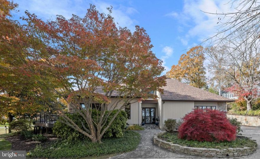 OPEN HOUSE THIS SATURDAY, FEBRUARY 7, FROM 1:00-4:00 PM!

Simply stunning and move-in ready! Nestled on nearly half an acre of beautifully landscaped grounds, this elegant, fully renovated, contemporary home offers comfort, style, and privacy. Built in 1988 by premiere contractor Bert Winchester, and then beautifully remodeled by Think Make Build in 2021, this 3,809-square-foot exquisite residence has four bedrooms, and three and a half baths. A stone walkway and garden walls lead to an inviting front entrance. Surrounded by lush greenery, the property blends seamlessly with its natural setting and borders an undeveloped Gibson Island Corporation owned lot that ensures lasting privacy. Thoughtfully designed outdoor spaces encourage relaxation and connection with nature—ideal for morning coffee on the wrap around deck or evening gatherings in the secluded back courtyard. The courtyard is enclosed by beautifully crafted stacked stone retaining walls offering a rich, layered look with stone steps to the backyard.
The main level features a spectacular two-story great room with gorgeous finish work, including built-ins, a handsome stone gas fireplace and multiple open living and dining spaces. Enjoy the inviting cozy den overlooking the backyard with a second stone, gas, fireplace, a newly renovated chef’s dream gourmet kitchen, complete with high-end appliances and custom teak style cabinetry, and wet bar, plus an additional built-in outdoor kitchen with Wolf appliances.  The main level offers a primary bedroom suite with spa-like bath and a second bedroom with Murphy bed, which could also be used as a home office, with an ensuite full bath.  A beautifully designed laundry room with stunning cabinetry is located off the Kitchen.   Ascend the beautifully designed, modern open back tread stairs with cable railing to the upper level overlooking the gorgeous great room.  On the second level are two additional spacious bedrooms, a full hall bath, and an open sitting area. The lower level offers plentiful storage. There is a detached one car garage.
668 Broadwater Way is ideal for year-round living or a second home escape. The property combines the tranquility of nature with the sophistication of modern design. The home’s recent renovations and careful maintenance ensure a turnkey experience for its next owner. This is a rare opportunity to own a distinguished property that perfectly captures the charm of Gibson Island living.

Information on Gibson Island:
Gibson Island is a private island within one hour of Washington, D.C. and Baltimore offering an absolutely extraordinary setting.  The Island comprises 1000 acres with seven miles of shoreline. Two thirds of the Island is undeveloped and is owned by the Gibson Island Corporation, the homeowners' association.  The remaining third is residential home sites. 
Gibson Island is located on the western shore of Maryland, so there is no need to cross the Bay Bridge. On the Island is a 43-acre spring fed freshwater lake in which one may enjoy non-motorized watercraft activities such as paddleboarding, canoeing, kayaking, fishing and swimming.  
The Island offers enormous privacy and security--there is an entry gatehouse staffed 24+Hours, and the Island is patrolled by the Gibson Island Police Force (GIPD).  The Gibson Island Corporation Service Department offers yard maintenance and landscaping and other services for homeowners.  There is a full-service yacht yard.   From the Island, it is just a 20-minute drive to BWI Airport and the neighboring Amtrak train station.  
The Island houses a private country club (membership by invitation) offering yachting, fine dining year-round, tennis, an award-winning Charles Blair Macdonald designed 9-hole golf course, swimming, croquet, skeet shooting, and more.  (C)