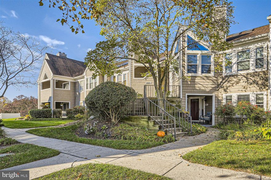 Move-in ready 2BR/2BA Townhome located in the desirable community of Ellicott City,.  Well maintained grounds and parking are just steps away from the front door of your new home. Step inside to an open concept floor plan featuring vaulted ceilings, beautiful flooring, and tons of natural light.  The open sided wood burning fireplace can be seen from the oversized living room, the spacious dining area, and the stunning kitchen. The kitchen is gorgeous boasting dark tone cabinets, complimenting granite countertops and a subway tile backsplash, stainless steel appliances including a slide in double oven range, and a breakfast bar peninsula.  A laundry closet with pantry space is tucked just behind the kitchen. Down the hall is the primary suite with vaulted ceilings and a private full bath, and the secondary bedroom and full bath.  The sliding doors lead to a cozy semi-enclosed deck that looks out over the community that offers a pool and playground. This home is move-in ready with so much to offer new homeowners and is close proximity to shopping, restaurants, and commuter routes.