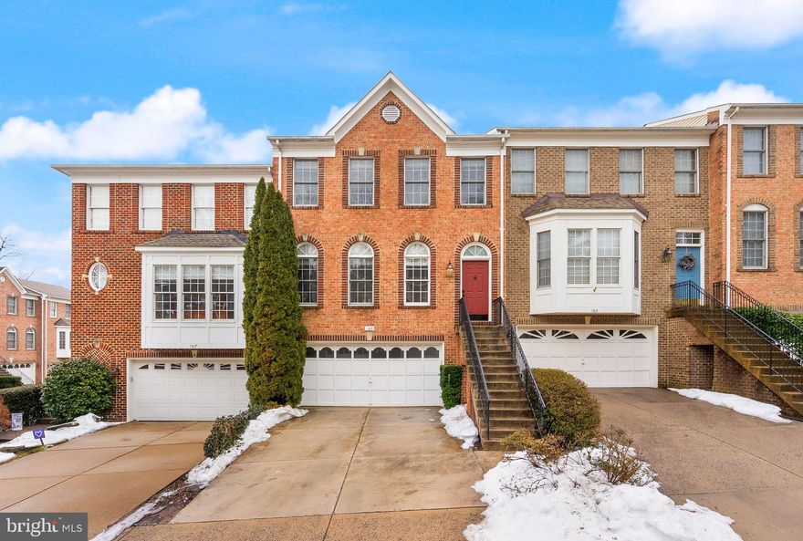 Fantastic three-level brick townhome offering 4 bedrooms and 3.5 baths, ideally located just minutes from Vienna Metro and Tysons Corner. Upon entry, you’re welcomed by hardwood floors that flow throughout the main and upper levels. The foyer includes a convenient coat closet. On the left, enjoy a spacious living and dining area, beautifully detailed with classic chair rail molding throughout. The home has been thoughtfully updated with a renovated kitchen featuring new cabinets and countertops (2025), new interior flooring on all three levels (2025), fresh interior paint (2024), and new rear patio and deck doors (2023). The eat-in kitchen offers stainless steel appliances (all replaced within the last 1–2.5 years), under cabinet lighting, a pantry, and ample cabinet storage. From the kitchen, you can access the large deck, perfect for outdoor dining and entertaining. The upper level features a spacious primary suite and two additional bedrooms that share a renovated hall bath with two sinks. The primary suite showcases tray ceilings, a large walk-in closet, and primary bath with two sinks, a soaking tub and separate shower. Also located on this level is the laundry area featuring a Miele washer and dryer (2025), and linen closet. The walk-out lower level features access to the garage, a coat closet, hardwood flooring and includes a recreation room with a gas fireplace, a fourth bedroom, and a full bath—ideal for guests or a home office. The HOA provides exterior common-area maintenance, snow removal, and gutter cleaning twice a year. Home includes a two-car garage. Visitor parking is available. Prime location just three blocks from Maple Avenue shops and dining, and walkable to Louise Archer Elementary School, 123 eateries, Whole Foods Market, the W&OD Trail, and Northside & Eudora parks. Quick access to multiple Metro stops and a short drive to Tysons Corner and Reston make commuting easy. Vienna is a vibrant small town known for its top-rated schools, walkability, and strong sense of community. This home truly checks all the boxes!