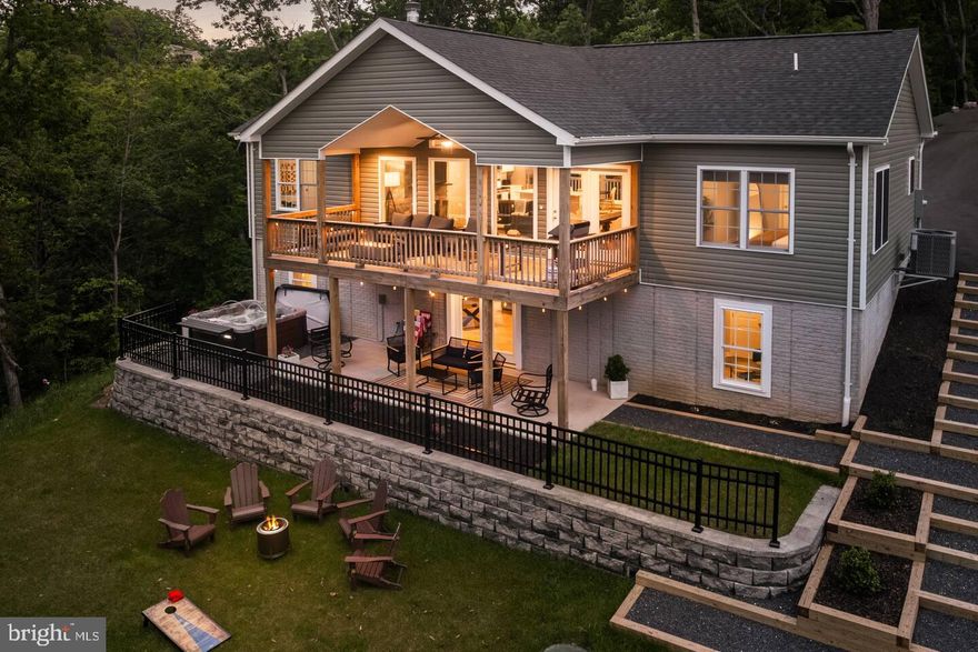 Nestled in a serene setting just a mile from the picturesque Shenandoah River, this exquisite ranch-style residence embodies the perfect blend of luxury and comfort. Built in 2024, this detached home showcases a stunning A-frame architectural design, complemented by high-quality vinyl siding and concrete finishes that promise durability and elegance. As you approach the property, the inviting brick patio beckons you to unwind and enjoy the tranquil surroundings. The meticulously landscaped exterior is perfect for entertaining, featuring a built-in BBQ grill that enhances your outdoor gatherings. With ample parking available on the asphalt driveway, accommodating guests is effortless. Step inside to discover a thoughtfully designed interior that radiates warmth and sophistication. The spacious layout includes four generously sized bedrooms and three full bathrooms, ensuring ample space for relaxation and privacy. The heart of the home features a cozy gas fireplace, perfect for creating a welcoming ambiance during cooler evenings. The kitchen is a culinary enthusiast's dream, equipped with top-of-the-line appliances, including a self-cleaning electric oven, microwave, and dishwasher. The sleek refrigerator and range hood add a modern touch, while the convenient washer and dryer make laundry days a breeze. Energy-efficient windows throughout the home not only enhance the aesthetic appeal but also contribute to a sustainable lifestyle. For those who appreciate wellness and relaxation, the property boasts a heated spa, inviting you to indulge in soothing moments after a long day. The security features, including 24-hour surveillance and smoke detectors, provide peace of mind, allowing you to fully enjoy your luxurious retreat. With water access just a short distance away, outdoor enthusiasts will relish the opportunity to explore the Shenandoah River. Whether you prefer canoeing, kayaking, or simply soaking in the natural beauty, this location offers a lifestyle of adventure and tranquility. This residence is more than just a home; it's a sanctuary that promises an exclusive lifestyle filled with comfort, elegance, and the joys of nature. Experience the perfect blend of luxury living and outdoor adventure in this remarkable property.
