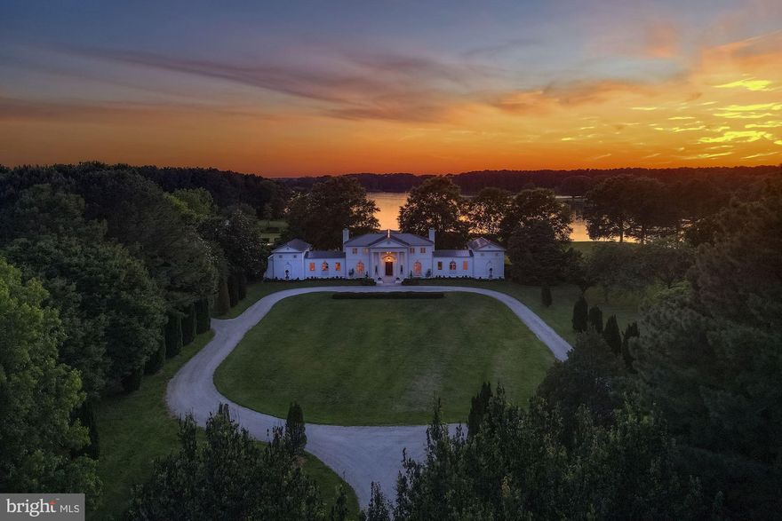 Belle Rive, an enchanting 130+ acre waterfront estate with over 1400’ of direct water frontage on Leeds Creek,  home to many magnificent manors and estates of Maryland’s storied Eastern Shore. This custom-designed residence is highlighted by grand rooms, a private beachfront, a multi-slip pier, a 2.5 acre pond, and a two-story pool house with a guest suite, outdoor kitchen, patio, and elegant swimming pool. The main residence welcomes you via a 2-story open center hall foyer with a custom mural, grand circular staircase. To the left of the foyer is the grand dining room with a fireplace and seating for up to twenty guests. The adjoining, classically-designed gourmet chef’s kitchen features a fireplace that is an exact replica of a French hearth. Special amenities include a La Cornue range, expansive marble-topped island, breakfast area, pantry, and top-of-the-line appliances. Beyond the kitchen is the oversized family room that opens to beautifully landscaped side patio. Continue from the family room up a staircase to a bright library (or home office/ guest suite, or 6th bedroom) with a terrace and full bath. To the right of the foyer are the grand double living rooms, each with their own fireplaces. French doors from all public room open to the rear patio overlooking the sweeping yard and expansive water views, perfect for entertaining. Beyond the living rooms, a private hallway leads to two main level guest bedrooms and full bath. Designed to be a wing of their own, these bedrooms offer complete privacy for houseguests and easy access to the grounds and other amenities. The upper level of the home features a spacious, sun-filled primary suite with water views, a fireplace, a completely updated luxurious marble bath, and a large master closet. Two additional bedrooms each with ensuite baths, and a laundry room complete the second level.  Views from every part of this stunning residence are absolutely breathtaking. Outside, enjoy the verdant grounds with manicured lawns and mature landscaping. A pathway leads to the exquisite pool house and inviting pool. The 2-story pool house boasts an outdoor kitchen, large indoor bar, sitting room, billiard room with fireplace, 2 bedrooms, 2 full baths, laundry, and open porch with fireplace make for a perfect environment for entertaining.  Additional amenities on this mesmerizing property include the 2.5 acre fully stocked pond with a duck blind, brand new 4-car garage with mahogany doors, farmland, wooded acres, private beach, and such much more.  Truly a must see!