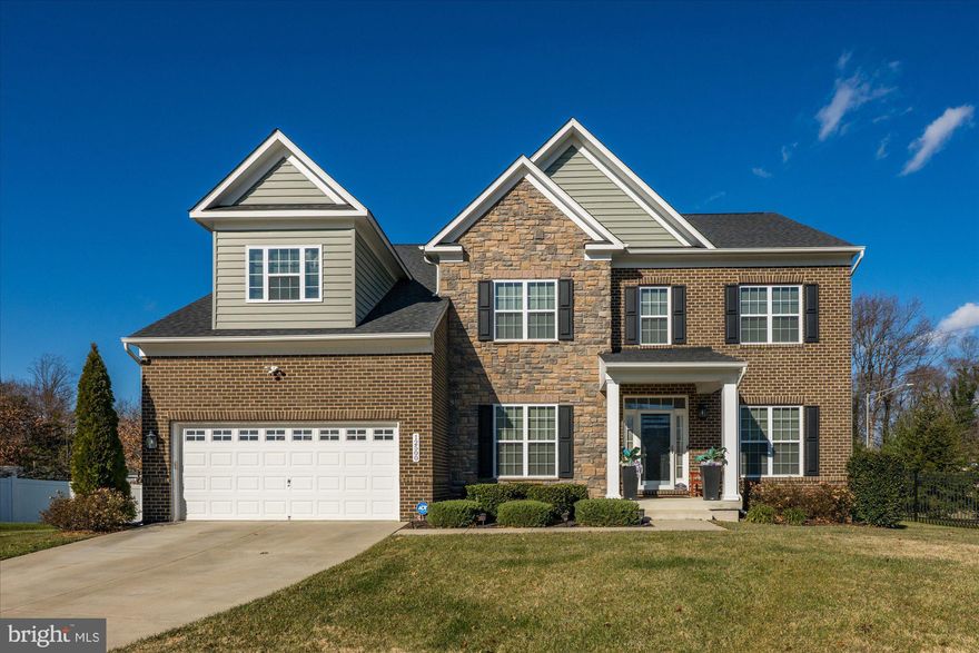 Introducing an exceptional opportunity to own a grand 2019-built residence in the sought-after Villages of Savannah community. Set on a quiet cul-de-sac at 2500 Monterey Park Court, this impressive six-bedroom, six-and-a-half-bath home combines modern craftsmanship, thoughtful design, and luxurious scale for today’s lifestyle.
The welcoming entry opens to a dramatic two-story foyer and expansive open-concept living spaces anchored by rich hardwood floors and abundant natural light. The gourmet kitchen serves as the heart of the home, offering an oversized center island, premium stainless steel appliances, extended cabinetry, and a generous walk-in pantry. Seamlessly connected is a sunlit family room featuring a fireplace and room for gatherings of any size. A formal dining room and separate living room elevate the home’s entertaining capacity, while a main-level bedroom suite provides convenience and flexibility for guests or multi-generational living.
Upstairs, a serene primary suite awaits, appointed with double walk-in closets and a spa-style bath with dual vanities, a soaking tub, and a frameless glass shower. Four additional upper-level bedrooms each offer en suite or adjacent full baths. The fully finished lower level extends the home’s living space and includes a sprawling recreation room, fitness or media space, a sixth bedroom, and full bath, with walkout access to the backyard.
Outdoors, enjoy a generous yard perfect for play, gardening, or future outdoor enhancements. A two-car garage, large driveway, and ample storage complete the offering.
Ideally located near commuter routes, retail, dining, parkland, and Joint Base Andrews, this home delivers space, comfort, and sophistication in equal measure. Move-in ready and built for the way you live today, 2500 Monterey Park Court is an exceptional value in one of Brandywine’s most desirable neighborhoods.