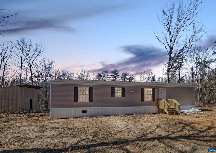 Wonderful opportunity for investors! This brand new single-wide home with 2 bedrooms and 2 full baths sits on 3.46 acres. The well and 3-bedroom conventional septic have been installed, but there is still work to be completed such as the electricity and plumbing connections, the back stoop, driveway, sidewalk, installation of the storm door, yard grading, and converting to real estate. (This may not be an exhaustive list.) There is a shed/workshop on the property that would provide excellent storage with a little more attention, such as steps, a door and a new roof. The remaining work will need to be completed by the buyer. This property is sold AS-IS.