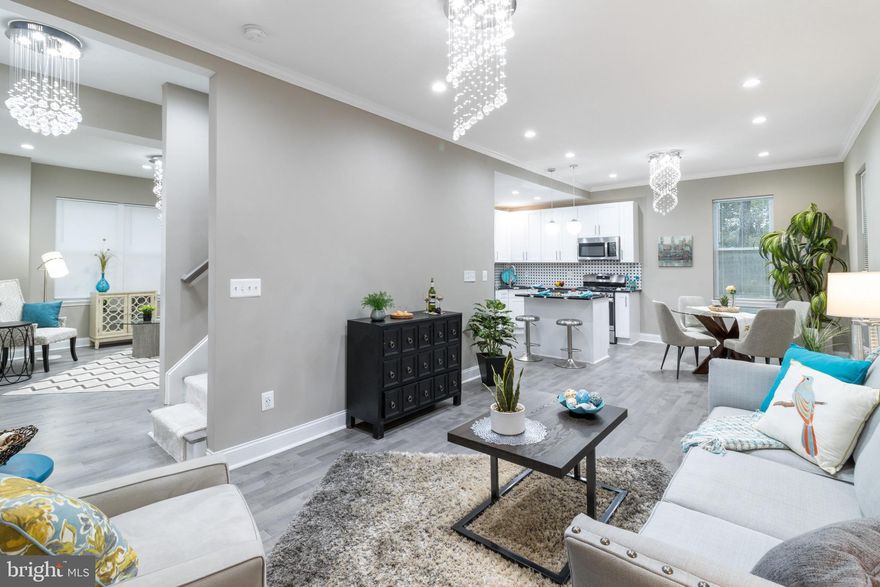 Welcome to the New "Pen Lucy"..This stylish colonial is just the beginning. Walk inside and be "wowed" by the updates and finishes throughout. All new hardwood flooring and plush carpet  will make you fall in love at 1st sight. The main floor has an open floor plan with a custom kitchen designed for a chef. There is a family room for entertaining, a dining area, and a walk out to a massive back yard for summertime fun.  The upper level has a primary master suite with tons of closet space with a private custom bath that will amaze you..The floor above has tons of space for multiple ideas with lots of natural light....The lower level can be used as a bedroom or for entertaining  lots of room and space.... All new plumbing and electrical, dual zones HVAC. This is city living at it's finest..don't miss it....Bring your offer NOW!!