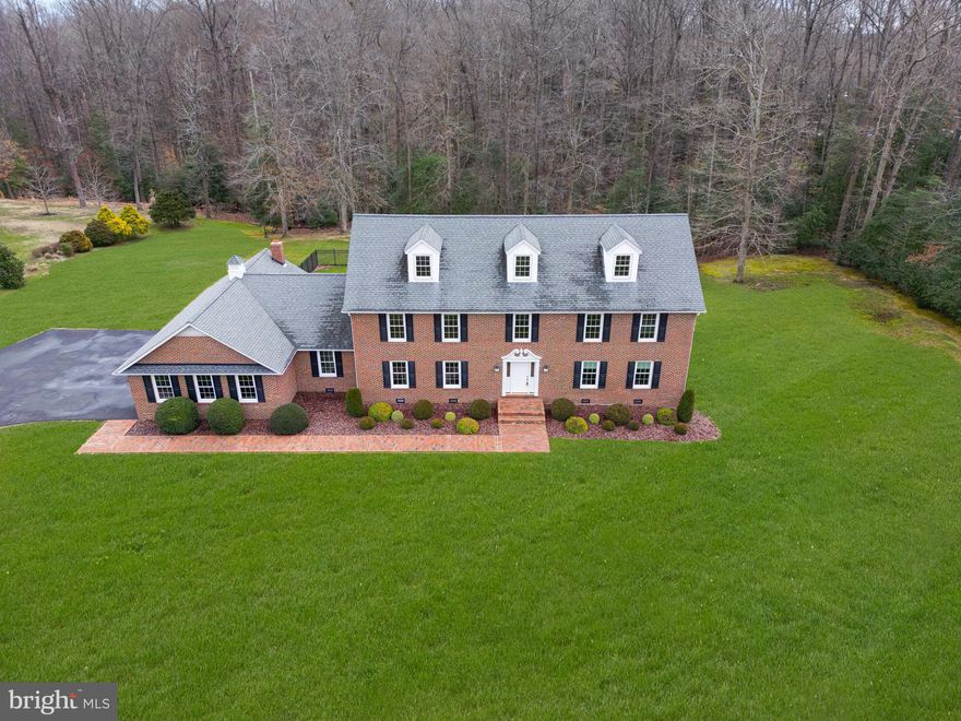 BIG BRICK BEAUTY! No corners were cut when building this custom home....built by the builder for his only daughter! This Stately Colonial sits on an impeccable 2+ acre lot in sought after Caernarvon Woods. With over 5000 sq ft of living space, this home was made for entertaining. The large kitchen is equipped with plenty of counter & cabinet space, and a breakfast nook. Holidays and special occasions won't be a problem with the large dining room, 28x20 great room, 33x15 Four Seasons room, and 35x15 enclosed porch. Open the doors between the four seasons room and the enclosed porch to create a room large enough for any event! The main level features a 5th bedroom (window leads to the four seasons room) with full bath. Make your way upstairs where you'll find the primary bedroom complete with a large sitting room (could be used as a WIC), full bath with soaking tub, shower, sink, and a walk-in closet. You'll also find 3 additional spacious bedrooms, another full bath, and the laundry area. Continue to the 3rd level rec room with built-in storage, and full bath....the perfect place to have game night or hang out with guests.  Get ready for summer parties on the back patio overlooking the in-ground pool complete with a fence. The backyard is level and backs to the woods. Plenty of parking with the 3-car side loading garage featuring auto openers and a separate storage space (the 3rd bay is for storage and lawn equipment). Features & Updates include: new carpet, fresh paint, geothermal heating & air, 2x6 exterior walls, new pool liner /filter/cover in 2022, new electrical panels in 2021, driveway sealed in 2022, and so much more! This home will sell itself....just open the door!