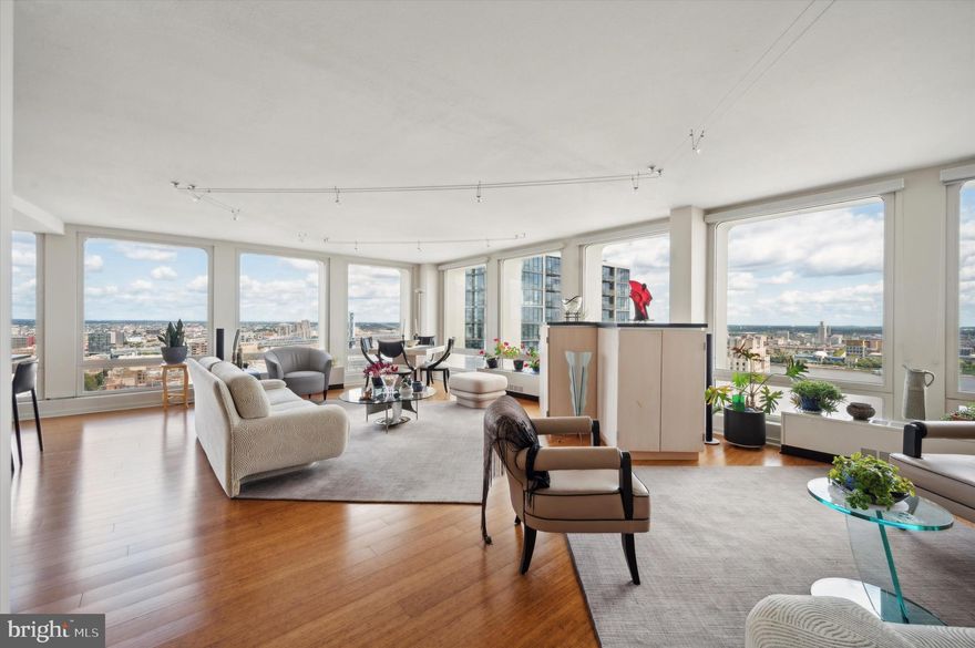 Have you ever wanted to live in a house located 30 stories in the sky? Welcome to Unit 30BCD, a truly one-of-a-kind condominium in the SOUTH tower of I.M. Pei’s famed Society Hill Towers. This MASSIVE CORNER UNIT is the product of THREE COMBINED UNITS (B, C, and D units) on the 30th floor, culminating into virtually 2800 square feet of expansive and refined living space, and providing stunning Northern, Southern, and Eastern views of Society Hill, the Delaware River, Ben Franklin Bridge, Walt Whitman Bridge, Sports Complex, Camden, and much more. Given it’s unique construction (floor plans available), this unit lends itself to a variety of configurations, but at it’s core it provides FOUR LARGE BEDROOMS and THREE FULL BATHROOMS, as well as an ENORMOUS OPEN LIVING ROOM and completely renovated and ENLARGED KITCHEN. The entirety of the unit also features beautiful BAMBOO FLOORING, huge floor-to-ceiling windows with transparent shades or blackout shades (in bedrooms), and UPDATED HEATING/AC CONVECTOR SYSTEMS with individual room thermostats. The owners have spared no expense in adding NUMEROUS UPGRADES AND RENOVATIONS (full list available), including enlarging the primary bedroom by 6 feet, adding dual walk-in closets (designed by Crate & Barrel) to the primary bedroom, and combining two small bathrooms to form one massive primary bathroom (featuring a double vanity, Toto toilet and bidet, and glass shower and steam room). Other upgrades include: enlarging kitchen by 6 feet and adding quartz countertops, a Sub Zero refrigerator, and Bosch appliances; adding custom French decorative doors leading from living room into one of the bedrooms; jacuzzi tub in one of the bathrooms, and adding several built-ins and shelving systems. PLEASE REQUEST FULL UPGRADE LIST! If that wasn’t enough, the owners added a FULL SIZE LAUNDRY ROOM, complete with multiple pantries and a large secondary refrigerator and freezer. This enormous unit offers a TREMENDOUS AMOUNT OF STORAGE SPACE in general, even outside of the various walk-in closets. PLEASE NOTE: Two of the large bedrooms are currently being used as private offices (one for each owner), and are furnished as such. In addition to this stunning unit, the Society Hill Towers is a truly full-service complex.  Amenities include doorman and 24-hour security, on-site management and fitness center. Pool (extra charge), GARAGE PARKING on rental and availability basis. The monthly condo fee includes all utilities. You will rarely see another condo like this!