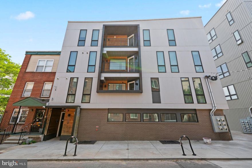 Welcome to 1716 Cambridge Street!  Unit 3 is a bright and airy condo, located on the 2nd level of a modern boutique building. The sleek entrance to the building includes a video intercom system to communicate with guests and provide remote access.   Enter the condo into an expansive, open-concept floor plan.  The stunning kitchen boasts white shaker cabinets, quartz countertops, a custom tiled backsplash, stainless steel appliances, island seating with pendant lighting and an adjacent dining area. The home includes wide plank hardwood floors and recessed lighting throughout.  The spacious living room includes oversized windows and access to one of two balconies.  The primary bedrooms suite includes a huge walk-in closet, access to the 2nd covered balcony, a luxurious bathroom with double vanity, a large walk-in tiled shower with rainfall showerhead and a private water closet. The secondary bedrooms are generously sized with oversized windows, each with adjacent full bathrooms with tub-shower combo.  Enjoy the convenience of in-unit laundry.  Located in the bustling Francisville neighborhood where you can enjoy nearby cafes, restaurants and venues such as The Met.  Easy access to the broad street line, Fairmount Ave and easy commute to Temple University and Hospital.  Low Taxes due to the tax abatement. Approximately 4 years remain.  Low condo fees.