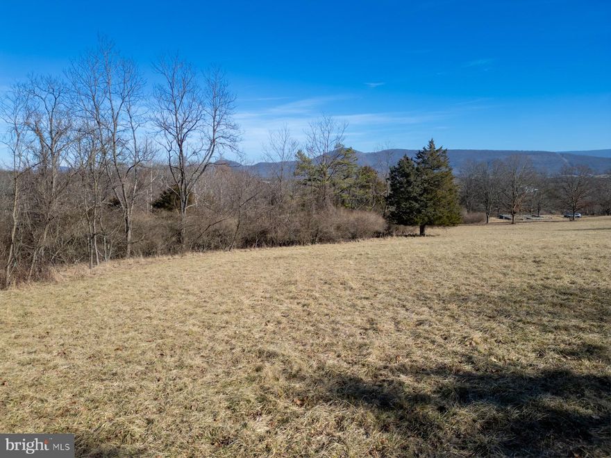 Discover the perfect slice of West Virginia paradise with 1.35 acres of prime, unrestricted land. This listing is for Lot 3, but Lot 2 is also for sale, buy them both to get 2.7 acres! With no HOA!  The only thing not aloud are single-wide trailers, so you have the freedom to create a cozy homestead or build your dream home. Picture yourself on your future deck, savoring breathtaking views of valley mountains during the day and stargazing under the pristine night sky. Public water hook-ups, available electricity, and the guidance of a reputable contractor-owner make these lots an exceptional find. Just a short drive from Moorefield (15 mins)  and Romney (25 mins), and a convenient 2 hours and 20 minutes from Washington, DC, these lots offer the ideal blend of rural serenity and accessibility.