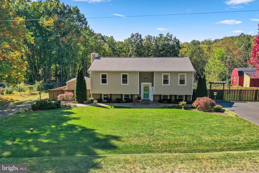 Welcome Home to your private oasis designed for luxury & comfort! This stunning property offers 5 Bedrooms, 3 Full baths, custom shiplap & Premium LVP flooring throughout. The renovated gourmet kitchen features stainless steel appliances, Quartz Countertops, soft close cabinetry, a custom island, & a stylish wine bar that’s perfect for entertaining. The luxurious primary suite is a true highlight with a barn-style door & a custom ensuite that includes a dual shower with a built-in bench & marble tile surround, dual vanity, large soaker tub, ceramic flooring, & an expansive walk-in closet with custom shelving built in. The upper level also has a Dining Area, a Living Room, & 2 additional bedrooms, with one Bedroom featuring a built-in Murphy Bed & custom wall cabinets. The Lower level opens up to a large Family Room with a Fireplace & custom surround sound speakers. This level also features the other 2 bedrooms, a full bathroom, & a large laundry room with updated washer & dryer, a sink, an additional Refrigerator, & custom built-in storage cabinets. Step outside to beautifully landscaped front & back yards that include stamped-concrete patios, a large deck for entertaining, an irrigation system, & a whole house generator. Enjoy a refreshing dip in the sparkling saltwater pool, or hang out in the 3 seasons screened in porch while you cheer on your favorite football team on the flat screen TV, or even pop some popcorn for a movie night on the projector screen. Parking is never a concern with 2 driveways; the second driveway leads to a cleared area with room to build a garage or storing your boat. You are just a short distance from two marinas, enhancing your recreational options, & 7 miles away from the Marine Corp Base. This neighborhood does not have an HOA, allowing you the freedom to personalize your property. This exceptional home offers the perfect blend of style, comfort, & convenience, making it the ideal retreat for those seeking a life of luxury with the freedom to create their own personal paradise.