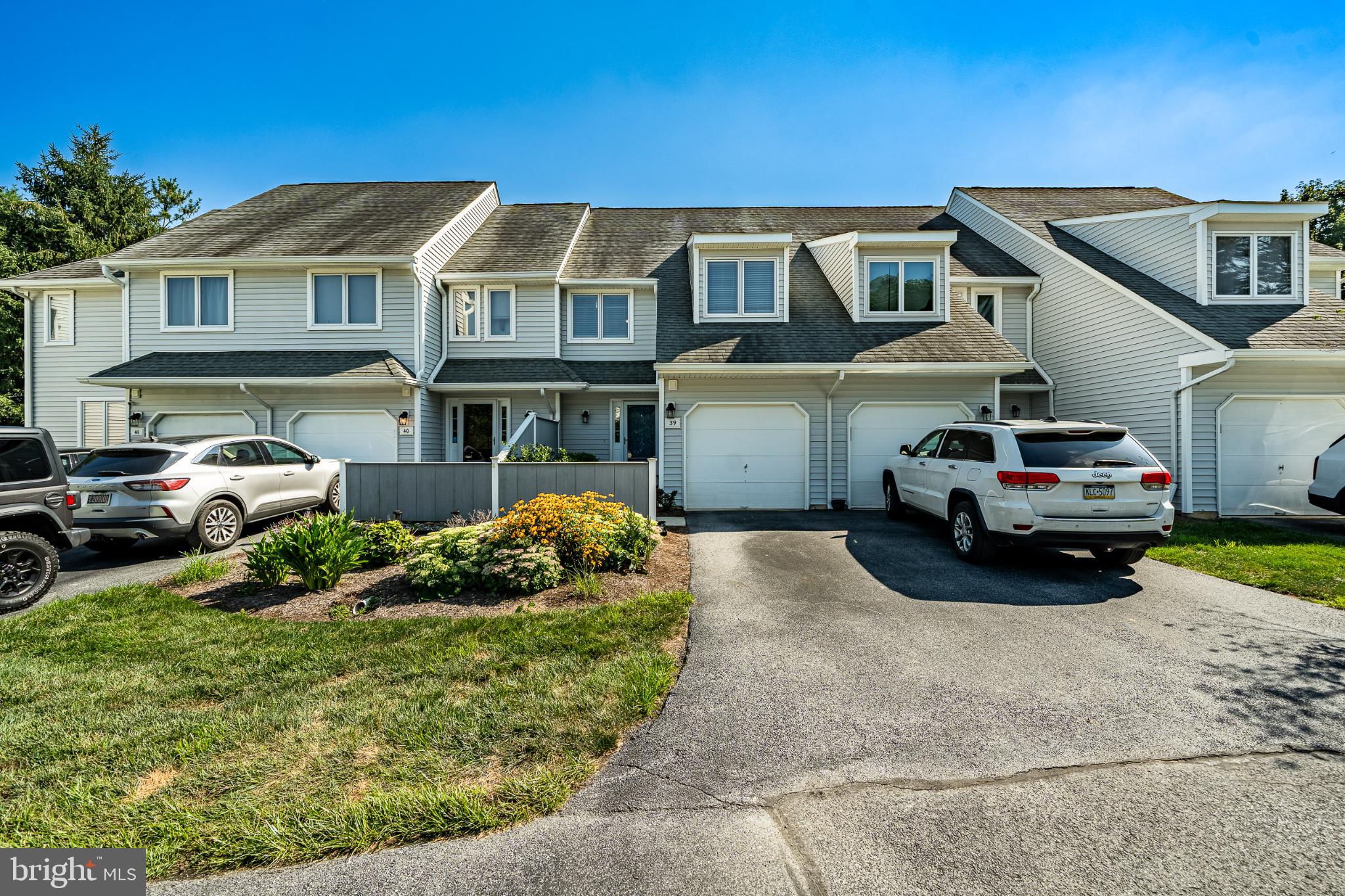 Welcome to this beautifully maintained and move-in ready 3-bedroom, 2.5-bath townhome located in the highly desirable Orchard Valley Community near Longwood Gardens, Kennett Square, and West Chester, PA. Perfectly situated just minutes from Wilmington, Delaware, top-rated restaurants, boutique shopping, and major commuter routes including Routes 1, 202, and 52, this home offers the ideal blend of comfort, convenience, and location. Step inside and enjoy the light-filled open-concept floor plan, complete with neutral paint colors, updated lighting fixtures, and newer flooring throughout. The modern kitchen is equipped with granite countertops and stainless steel appliances. The spacious living and dining areas flow effortlessly to the private rear deck, a tranquil outdoor space with peaceful backyard views, perfect for relaxing or hosting guests. A first-floor powder room adds additional convenience. Upstairs, the primary suite features a walk-in closet and a private en-suite bathroom, while the second bedroom includes its own full bath, making it ideal for guests or family. A convenient second-floor laundry area completes this level. The third floor boasts a versatile bonus room, perfect as a third bedroom, home office, gym, or playroom. The unfinished basement offers exceptional storage and the potential to add even more finished living space. A one-car attached garage with high ceilings provides additional storage and utility. This low-maintenance Orchard Valley townhome is the perfect blend of modern upgrades, thoughtful design, and prime location. Whether you're a first-time buyer, downsizing, or searching for a second home near Longwood Gardens and Brandywine Valley, this home checks all the boxes. Don’t miss this opportunity, schedule your private tour today and make this exceptional property your next home!