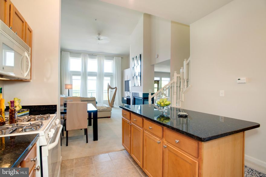 This 1 BED PLUS LARGE DEN/BONUS ROOM is full of natural light filled throughout and a top floor unit with unique 2-level living.  This spacious and open floor design includes a gourmet kitchen with a separate dining area.  The living room features soaring windows with vaulted ceilings that provides natural sunlight throughout and a three-sided gas fireplace.  Finishing the main level is a separate den/bonus room that could be used as #2 bedroom with a spacious closet and a half bathroom.  Second level living includes the master bedroom with a walk in closet and full bath. This unit is perfectly situated in the heart of Reston Town Center with walking accessibility to restaurants, shopping, public transportation and metro.  A must see!