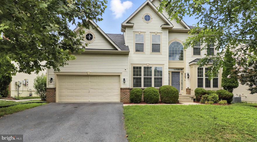 Exceptional Opportunity to get a home with a 4% Assumable FHA Loan with Roam.  And this home has over 4,000 square feet of refined comfort and modern elegance in the highly sought-after Woodmore Town Centre Subdivision. Built just 10 years ago and meticulously maintained by the original owners, this impressive 5-bedroom, 4.5-bathroom home offers space, style, and sophistication on every level—including a fully finished basement designed to suit a variety of lifestyles.  As you step into the grand foyer, you’re greeted by rich dark hardwood flooring that extends throughout the open-concept main level. The seamless layout connects the spacious family room to the gourmet kitchen, which boasts 42-inch dark wood cabinetry, granite countertops, a central island, stainless steel appliances, a built-in oven and microwave, and a gas cooktop—perfect for entertaining or simply enjoying your morning coffee.  Upstairs, each bedroom offers generous space and large closets. The luxurious owner's suite is a true retreat, featuring a massive walk-in closet, spa-like bath with a soaking tub, glass-enclosed shower with built-in seat, dual vanities, and ample natural light.  Enjoy convenient main-level laundry with a full-sized washer and dryer set beneath deep storage cabinetry. The low-maintenance backyard provides a tranquil escape, ideal for relaxing mornings or elegant evening gatherings.  The finished basement adds even more flexibility, featuring a fifth bedroom, bonus room, wet bar, and plenty of open space to tailor to your needs—whether a home theater, gym, or game room. Additional highlights include: Two-car garage and spacious driveway with ample off-street parking, Solar panels (leased, nearly paid off) — recent electric bill was just $8!  Access to top-tier community amenities including a clubhouse, fitness center, tennis courts, and swimming pool.  Prime location just minutes from I-495, I-95, Route 50, BW Parkway, and only 20 minutes to Washington, D.C.  Quick access to shopping, dining, and everyday essentials.  This is your opportunity to own a modern, move-in-ready home in one of the area’s most prestigious communities. Don’t miss out—schedule your showing today! Owners are in the process of moving—please pardon the boxes.