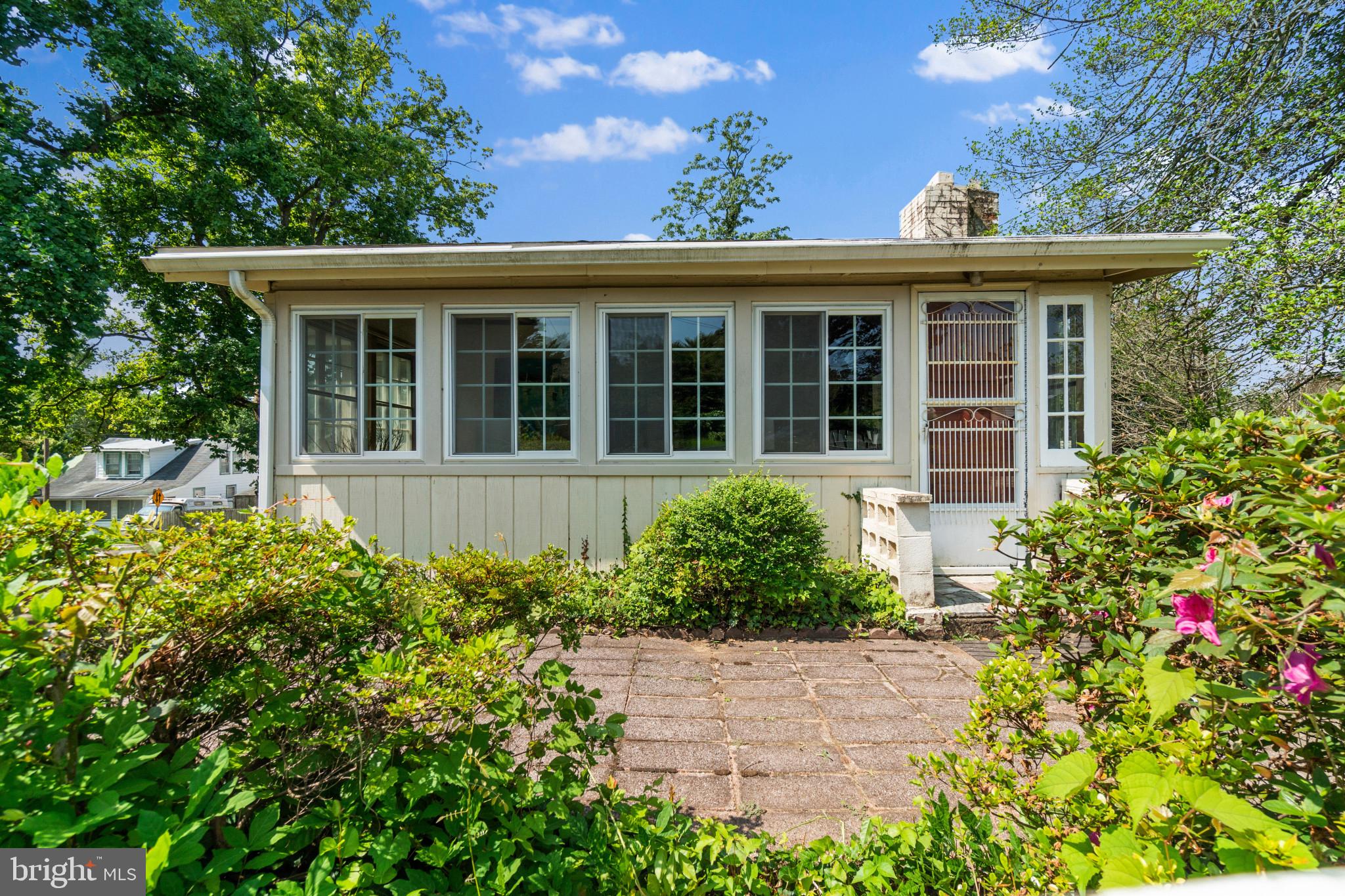 This charming cottage is perfectly sited on a large corner lot in the amenity-rich waterfront community of Sylvan Shores. Timeless details can be seen throughout such as beautiful pine wood floors, exposed wooden beams and intricate woodworking. The interior consists of a family room with vaulted ceiling, exposed beams and wood-burning fireplace, two bedrooms, a full bathroom and kitchen with banquette, dining area, basement and large attic. The home is brimming with potential and could be the site of a new or newly remodeled home. The community offers public water and sewer. Sylvan Shores is a private water-privileged community set on the scenic South River, Granville Creek, and Hardesty's Cove waterways in Anne Arundel County. Community amenities include water access, boat ramps, a large recreational swim pier, boat docks and slips, kayak/paddle-board racks, boat trailer parking lot, a clubhouse with a playground, a ballfield, walkable parkways, and numerous open park spaces. This location offers easy access to shopping, restaurants, entertainment and commuter routes. This property offers an excellent investment opportunity for those looking to build their portfolio or create a unique living space in an excellent location. Don't miss out on this incredible opportunity!