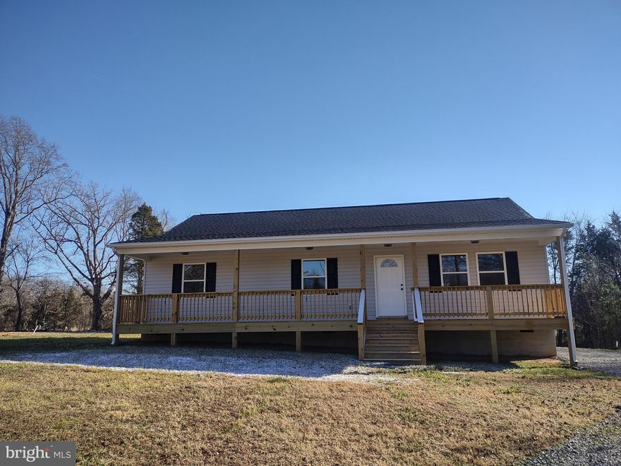 Welcome to your new paradise in the country! This NEW charming rancher in Louisa County is just minutes away from Lake Anna and is ready to be called home! When you enter this home, you're greeted with stylish vinyl flooring and a large open concept room flowing into the kitchen.  There you find modern appliances accompanying granite countertops with endless kitchen space. The owner has installed brand NEW WASHER and DRYER machines as well! On the other end of the home, there's two large bedrooms with a full bathroom across the hallway.  The primary suite showcases endless natural light with a large closet and private full bathroom! Spin time relaxing and having barbeques with friends and family on the back deck with lots of shade and nature to soak up! The yard space is endless here with green grass and trees to admire. This stunning new home brings comfort, modern finishes, and country living all in one! Don't miss seeing this beauty! It won't last long.