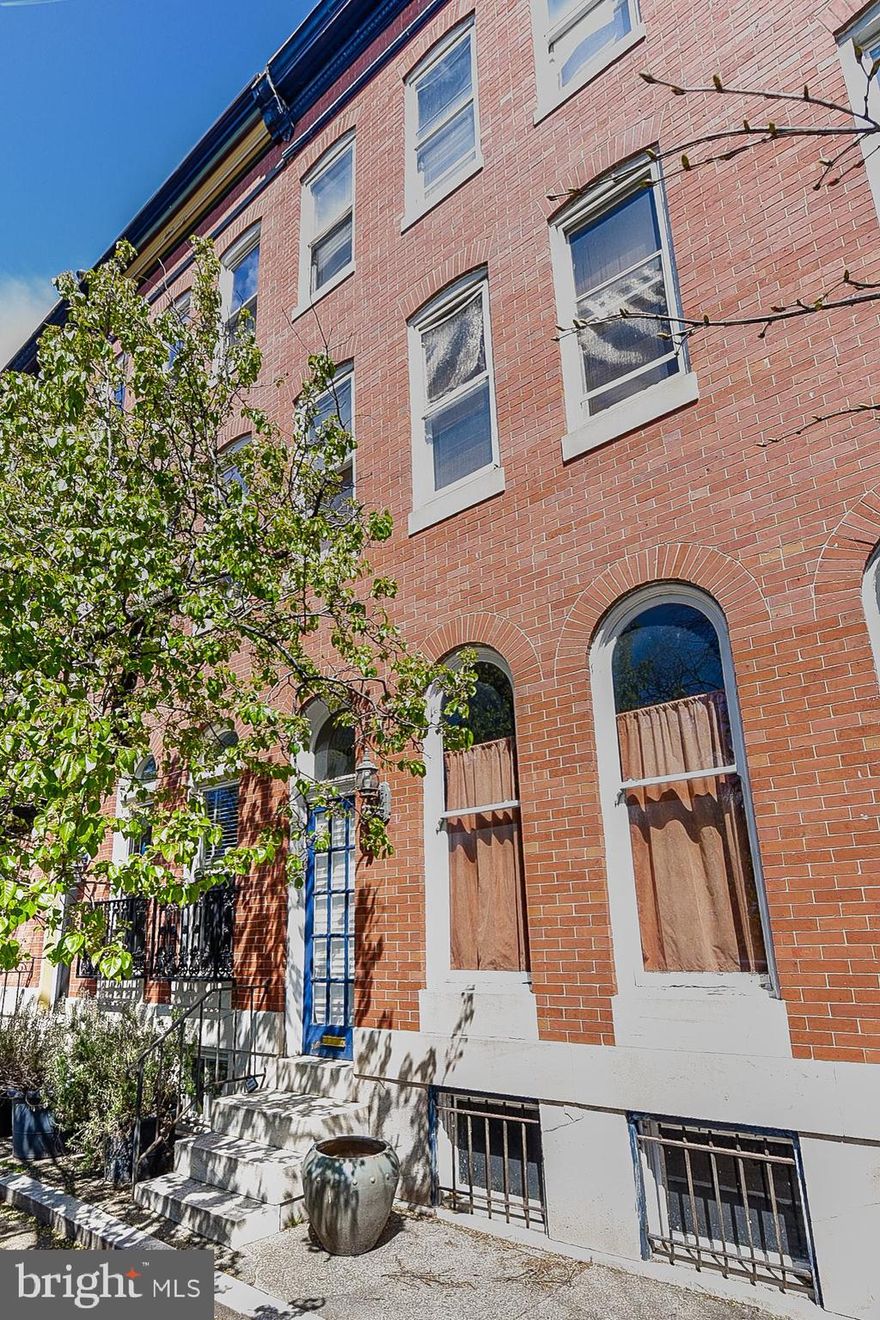 INCREDIBLE INVESTMENT OPPORTUNITY!  PARK FRONT PATTERSON PARK ROWHOME WITH TONS OF POTENTIAL!  Property is perfect for a builder looking for their next renovation with renovated comps in the $600k+ range!  Potential for 4 finished levels, over 2,600 sq. ft. of living space, off street parking, and desirable park front location!  Sold As-Is!