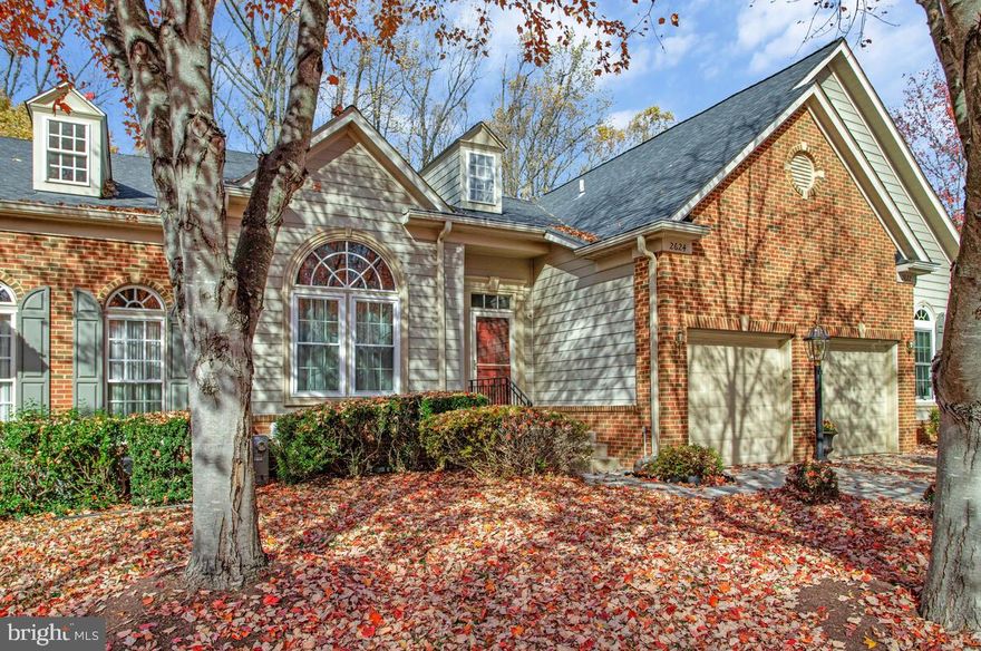 Main level living GEM (NOT 55+) situated on quiet Turf Valley street backing to woods offers an elevated lifestyle! Relax knowing the low cost HOA handles the lawn, leaves, & snow. Greet guests at the covered front porch entry (also ideal for keeping delivered packages safe & out of the weather) - the dramatic volume ceilings & wood flooring in both the living & dining rooms offer ample space to entertain & host gatherings (living room also has a cozy gas fireplace); the stunning fully remodeled kitchen (2018) includes an island, additional prep/serving area & thoughtful pantry cabinet all flowing effortlessly into the rear sunroom where you will enjoy an ideal place to relax & unwind.  Or step out onto the deck to take in wooded views & fresh air. The generous main floor primary suite is also just steps away; wait until you see the fully remodeled ensuite bath with oversized shower (2017)! Main level also has a powder room bath, convenient laundry & one vehicle garage. The upper level offers a loft space, 2 bedrooms, a full bath & a storage closet. The walkout lower level is complete with another remodeled full bath (2017), lots of versatile living space + plenty of unfinished space for storage. This exciting package comes with the confidence knowing windows were replaced in 3/2025,  new roof in 6/2019, lower level slider door new in 3/2019, kitchen appliances new in 2017/2018, sunroom slider door new in 2016,  heating / cooling was new in 2015, gas water heater new in 2014 . Treat yourself to an end of year gift & make this rare opportunity yours - you will be excited & proud to call this your new home!