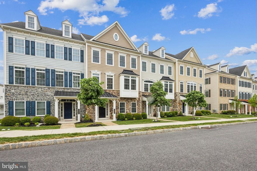 Welcome to this fully upgraded 4 bed / 3.5 bath townhome in Atwater, loaded with convenience features! Walk upstairs to the open concept main living level with eat-in Kitchen, dining room, and oversized Family Room, all with upgraded wide plank hardwood. The gourmet Kitchen features an expansive 13’ island with seating for 4+, upgraded quartz countertops, sleek modern cabinets, under-cabinet lighting, stainless-steel appliances, and a walk-in pantry. Open the French doors and enjoy the maintenance-free deck with a plumbed-in natural gas line for easy grilling. Upstairs, you’ll find a Laundry Room conveniently located between the Primary Suite and 2 additional generously sized bedrooms - the included front load washer & dryer on pedestals makes laundry a breeze. The Primary offers ample living space and features an upgraded octagonal tray ceiling w/ custom lighting, 2 walk-in closets, and a fully loaded bath with upgraded tile/counters, jetted tub and frameless showers. An additional full bath on this floor features a double vanity and upgraded tile/counters. The 4th bedroom on the ground floor is an en suite with a full bath and walk-in closet – a perfect space for guests. Well located in the Great Valley School District with walking trails, parks, shopping, and restaurants nearby, this townhome also has convenient access to off-street guest parking on the garage-side – great for hosting gatherings. Don’t miss your chance to own this beautiful home!