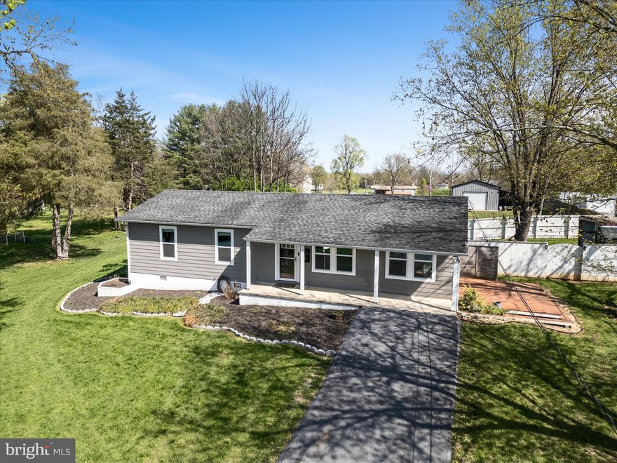 Modern and well-appointed rancher on a 1-acre lot with new detached garage and fenced yard! The whole house was redone several years ago – both inside and out – offering peace of mind for years to come. Key design features include shiplap ceilings, waterfall edge granite countertops, a stainless steel farm-style kitchen sink, upgraded bathroom vanities, and LVP floors throughout. This 3-bed/2 bath home is efficiently laid out with an open-concept living area that also includes a bonus room and separate laundry room. The new detached garage affords more storage space or room for hobbies. Surrounded by mature trees, the two decks and an inviting front porch make it possible to enjoy the outdoors and your own private yard without leaving the comfort of home. With an asphalt driveway, newer windows and siding, newer roof, and more, this tastefully designed single-level residence is move-in ready and in a great Jefferson County location not far from the Opequon Creek and with easy access to many local amenities and thoroughfares.