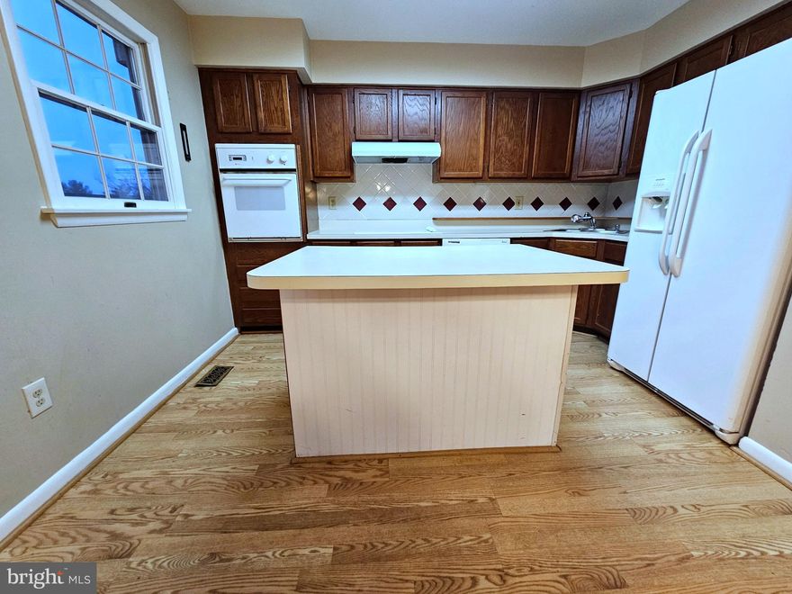 Beautifully Designed 3 Level Townhouse with Finished Walk Out Basement Offering Versatile Living Space and Incredible Potential! Vaulted Ceilings in the Primary Bedroom Create a Bright and Airy Retreat Complemented by a Spacious Walk in Closet. Thoughtful Floor Plan Provides Comfortable Living and Entertaining Areas Throughout. Finished Walk Out Basement Adds Valuable Flex Space Ideal for a Rec Room, Home Office, or Guest Suite. Enjoy Outdoor Living on the Private Deck with Additional Storage in the Shed. Home Needs Cosmetic Updates and is Priced to Reflect the Opportunity to Add Your Personal Touch and Build Immediate Equity!  Sold As-Is.