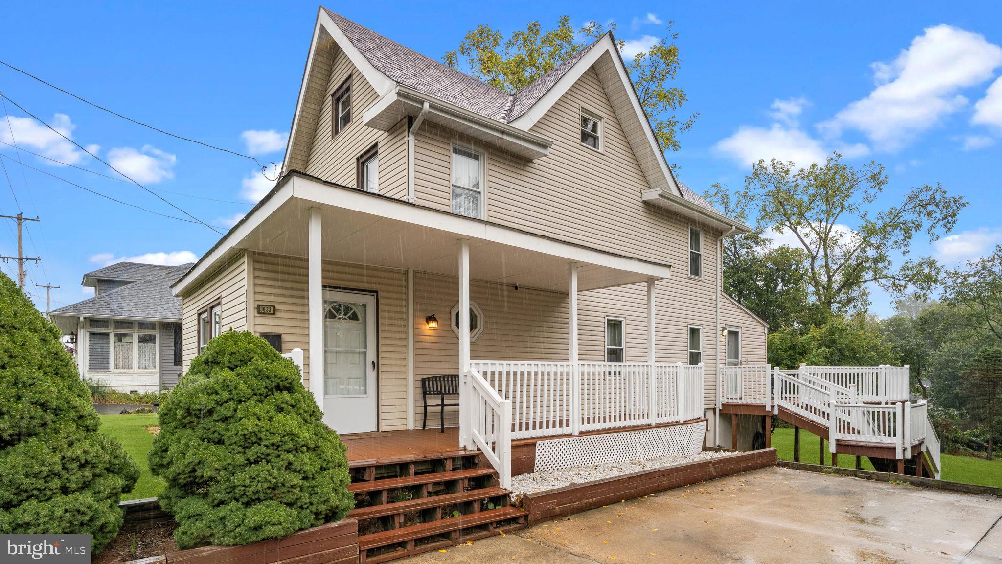 Get ready to fall in love with this move-in ready 3-story home that checks every box! Inside, hardwood floors lead you through a beautifully updated kitchen featuring granite counters, a sleek glass-tile backsplash, and stainless-steel appliances. Bright, comfortable three bedrooms include a versatile third-floor loft converted into a spacious bedroom or playroom, offering the perfect spot for an office, guest retreat, or creative space. The home welcomes you with a vestibule-style enclosed entry, creating a warm and practical transition space before you step into the main living areas. The spacious family room boasts rich hardwood floors and classic crown molding, providing an inviting setting for everyday living and entertaining. The adjacent eat-in kitchen and dining area offers the perfect blend of style and function, with plenty of room for gatherings and a modern backsplash that complements the natural wood cabinetry. You’ll find two updated full bathrooms—one with a soaking bathtub and another with a luxurious glass-enclosed shower with designer tile—offering comfort and convenience for everyone.
The walk-out basement/lower level provides generous storage space along with a convenient laundry area, making it as practical as it is spacious. Step outside to a huge wrap-around deck—ideal for morning coffee or cozy evenings—overlooking a spacious, private backyard. The oversized detached shed is perfect for hobbies, tools, or extra storage. From the charming front porch to the deck and serene tree-lined yard, every outdoor space invites you to relax or entertain. All this, with plenty of parking space, while being just a short stroll to local shops, dining, and major routes for an easy commute—a wonderful blend of charm, updates, and convenience!