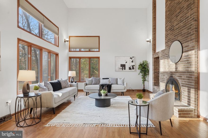 Discover a truly one-of-a-kind retreat at 8095 Plowden Drive, thoughtfully presented to highlight its distinctive design and serene setting. Tucked away on 2.5 acres of lush, wooded land, this contemporary cedar-sided home blends modern architecture with rustic charm in one of La Plata’s most well-established and sought-after neighborhoods.

Walls of windows flood the interior with natural light, offering panoramic views of the surrounding landscape. A warm brick fireplace anchors over 3,500 square feet of inviting living space, while the spacious deck provides the perfect setting for entertaining or enjoying peaceful solitude. The cedar exterior harmonizes beautifully with nature, and the recently painted partial wraparound deck (2025) invites you to relax and unwind. Private walking trails, a gentle stream, and abundant wildlife complete the retreat-like experience.

Recent updates provide comfort and peace of mind, including a brand-new roof (2025), new front storm door (2025), all new window cranks (2025), and crawlspace cleanup and remediation with new vapor barrier and insulation (12/2025). The home has also been freshly painted (2025), features new carpet (2025), and has been professionally cleaned - making it truly move-in ready.

A versatile additional suite with a private entrance and rough-in for a bathroom offers endless possibilities, whether used as guest quarters, a home office, workshop, or additional living space.

With a two-car attached garage and paved driveway providing ample parking, this property offers a rare combination of privacy, character, and convenience. If you’ve been searching for a distinctive home that feels like a private retreat while still being close to it all, this is an exceptional opportunity.