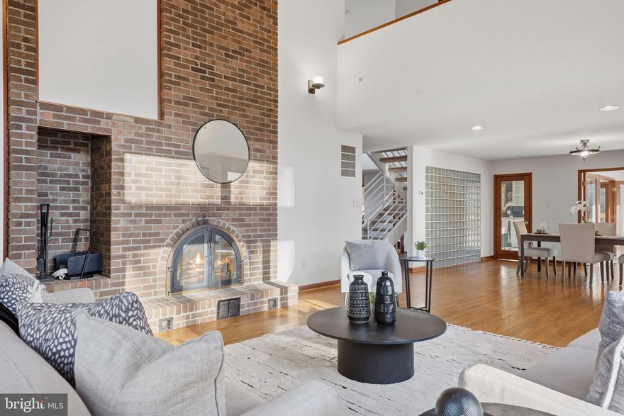 Discover a truly one-of-a-kind retreat at 8095 Plowden Drive, thoughtfully presented to highlight its distinctive design and serene setting. Tucked away on 2.5 acres of lush, wooded land, this contemporary cedar-sided home blends modern architecture with rustic charm in one of La Plata’s most well-established and sought-after neighborhoods.

Walls of windows flood the interior with natural light, offering panoramic views of the surrounding landscape. A warm brick fireplace anchors over 3,500 square feet of inviting living space, while the spacious deck provides the perfect setting for entertaining or enjoying peaceful solitude. The cedar exterior harmonizes beautifully with nature, and the recently painted partial wraparound deck (2025) invites you to relax and unwind. Private walking trails, a gentle stream, and abundant wildlife complete the retreat-like experience.

Recent updates provide comfort and peace of mind, including a brand-new roof (2025), new front storm door (2025), all new window cranks (2025), and crawlspace cleanup and remediation with new vapor barrier and insulation (12/2025). The home has also been freshly painted (2025), features new carpet (2025), and has been professionally cleaned - making it truly move-in ready.

A versatile additional suite with a private entrance and rough-in for a bathroom offers endless possibilities, whether used as guest quarters, a home office, workshop, or additional living space.

With a two-car attached garage and paved driveway providing ample parking, this property offers a rare combination of privacy, character, and convenience. If you’ve been searching for a distinctive home that feels like a private retreat while still being close to it all, this is an exceptional opportunity.