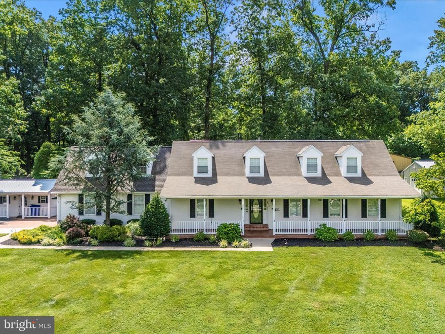 ENJOY HAVING EVERYONE OVER FOR THE HOLIDAYS!  Perfect home for ENTERTAINING large groups or MULTI-GENERATIONAL living.  Unique opportunity to WORK FROM HOME in style.  Ready to combine your business with the comforts of home?  This stunning property has a true great room with vaulted ceiling, kitchenette area and gas fireplace.   Off the GREAT/BONUS ROOM is another GREAT/BONUS ROOM also with a gas fireplace.  Either of these rooms or both would make a perfect space for an ARTIST, therapist, yoga studio, CrossFit GYM or personal training space.  The possibilities are endless!  Plus, there is an amazing amount of parking area for your guests.  You will love the GOURMET KITCHEN with quartz countertops, backsplash with under-counter lighting, DOUBLE OVENS PLUS A TWO OVEN RANGE, gas cooking a wealth of cabinet space and an island.  Off the kitchen is a nice size laundry room with cabinetry and a half bath.  This level also features a MAIN LEVEL PRIMARY BEDROOM with walk-in closet and updated bath with walk-in shower.  A formal BANQUET SIZE DINING ROOM, LIVING ROOM OR OFFICE and yes, ANOTHER FAMILY ROOM with a fireplace.  The main level alone is so impressive with its beautiful large rooms. Upstairs is a SECOND PRIMARY BEDROOM with walk-in closet and private bath along with TWO ADDITIONAL large bedrooms, a full bath, and a storage room.  There is a fabulous LOWER LEVEL RECREATION ROOM, DEN along with a large STORAGE room for all your extra things!  There is a beautiful brick paver patio with FIREPIT outside along with SEPARATE STUDIO.  Also, an oversize DETACHED ONE CAR GARAGE and all the way in the back a 4-BAY BUILDING WITH ELECTRIC- perfect for a CAR BUFF.  Dual zone HVAC (2024 and 2025)!!  Conveniently located near Spring Ridge so you have quick access to a grocery store, gas station and restaurants.  Easy access to I-70 and a short drive to Frederick for everything else you could possibly need.  Ready for immediate occupancy!