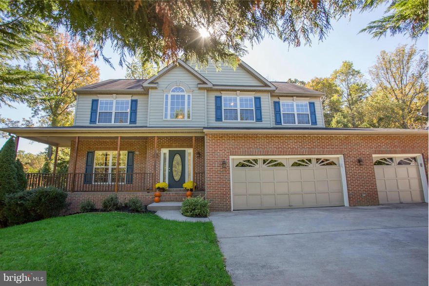 Lovely Colonial Nestled in a Private Tree-Lined Lot in Desirable Autumn Ridge. Features a 3 CAR GARAGE, Handscraped H/W Flooring, Separate Living/Dining Rms, Kitchen w/ Center Island, Gas Stove & Sunny Eat-in Area. Cozy Family Room off Kitchen with Gas F/P. Spacious MBR w/ Tray Ceiling and WIC, Fresh Paint, New Carpet & Upper Lvl Laundry. Home Warranty!  Close to MCB Quantico, I-95 and VRE.