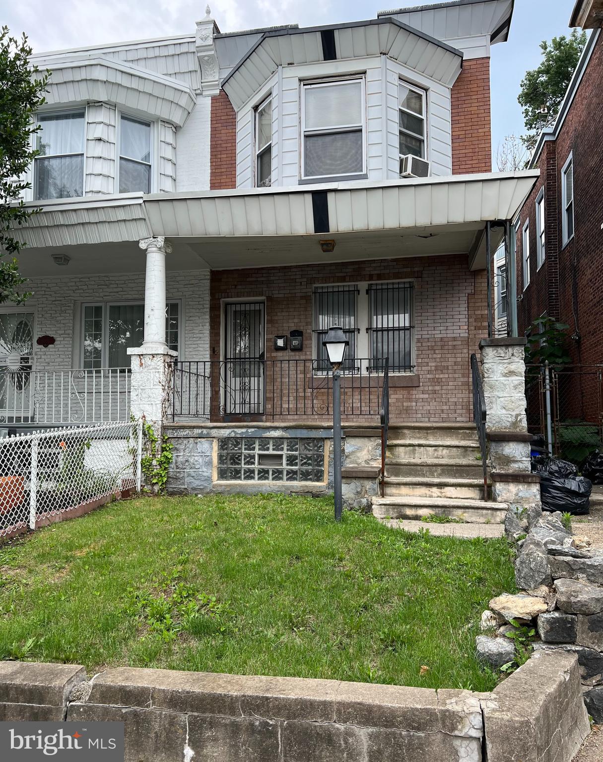 This gem of a property at this size isnt something that is available often. The first floor has finished original hardwood floors along with an updated kitchen and bathroom. There is a large bedroom with a bonus room that could function as an additional bedroom or home office. The rear door opens to an expansive back yard that is abutted by the US Post Office. The second floor unit is a large two bedroom unit in average condition , with original hardwood floors and plenty of sunlight.