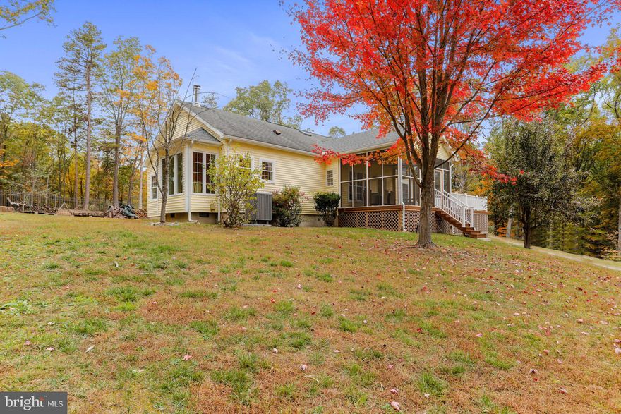 Beautiful 3 bedroom 3 bath rancher resting on 10 acres of beautiful mature landscape surrounded by trees  and plenty of nature to enjoy! Relax on the front deck or screened porch. Walk inside to the living room, dining room, sunroom, and kitchen with island, stainless appliances, and attached breakfast nook. All with hardwood flooring! The primary owner suite has an attached private bath, and there are two generously sized junior bedrooms and 2 additional full baths! Unfinished lower level with a built in garage space. Fully fenced yard! Truly a gem to call home and escape from it all!