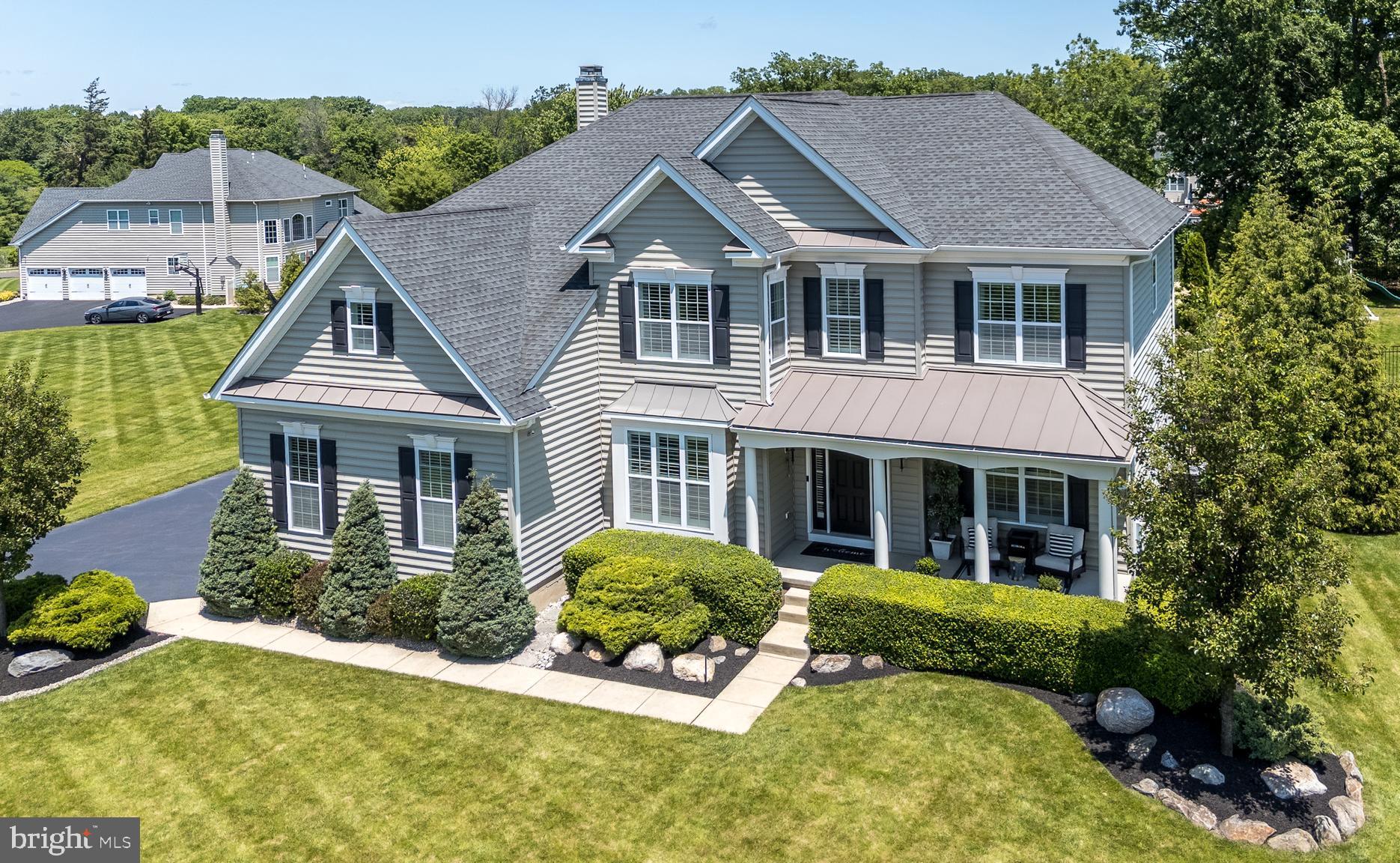 Open House is CANCELLED - home is under contract. Tucked away in the heart of Bucks County, this sophisticated, designer-curated home is a true masterpiece of luxury living. Every inch has been meticulously crafted with high-end finishes and thoughtful design. This one-of-a-kind home is the epitome of luxury, boasting designer finishes and architectural details that blend elegance with functionality. At the center of it all is the gourmet kitchen, complete with a 10-foot quartz island perfect for cooking and socializing with a walk-in pantry, under-cabinet lighting, and high-end stainless-steel appliances. A spacious breakfast area with a skylight and sliding door that opens to your private outdoor retreat. The adjacent dining room features custom wood beams that define the open-concept flow into the living room. A main floor office with glass doors, a two-story family room featuring a stacked stone gas fireplace with custom shelving, and Brazilian hand-scraped hardwood flooring that tie together the main living spaces with style and class. Two custom staircases—both front and back—are highlighted by modern black wrought iron railings, leading you to a breathtaking primary suite with a large bedroom and sitting area, and a carefully crafted walk-in closet with fingerprint lock. The ensuite bath is a showstopper, fully renovated with rich English walnut wood and luxury finishes throughout. Three additional bedrooms offer built-in closet systems and generous dimensions, with bedroom 2 enjoying its own private full bath. Bedrooms 3 and 4 share a Jack & Jill bath—perfect for a growing household or guests. The professionally finished basement adds another level of luxury with LVP flooring, a 5th bedroom, a kitchen, a full bath, English walnut shelving, and a pool table included—ideal for entertaining or multi-generational living. Step outside into your own private resort: a manicured yard, large pool with lighting, hot tub, stamped concrete patio with a natural gas fireplace, and a covered lounge area with TV. It’s a true backyard paradise built for making memories. This home is equipped with an advanced smart system that allows you to control the pool, spa, outdoor lighting, and irrigation—all from the convenience of a mobile app. Enjoy effortless luxury living with just a tap on your phone. Additional highlights include a spacious 3-car garage with mezzanine storage, plantation shutters and recessed lighting throughout, a built-in speaker system on the main floor and outdoor areas, and a two-zone HVAC system with two brand-new A/C units. For added comfort and convenience, the home also features new pool equipment, a water softener with reverse osmosis system, and a central vacuum system—every detail thoughtfully designed for luxury living and effortless maintenance. This home is more than move-in ready—it’s magazine-worthy. Schedule your private tour today and experience custom luxury like never before.