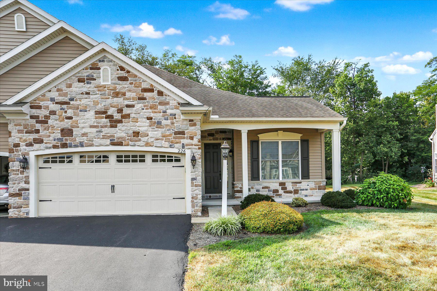 Discover the perfect blend of privacy, space, and low-maintenance living in this beautifully well-kept home in the sought-after Carmella 55+ community. Set on a private lot with a tree lined rear yard, you'll enjoy seclusion on your covered rear patio featuring a hard lined gas connection for outdoor grilling. The home has an expanded floor plan with 10' ceilings throughout and gas fireplace in the living room. The enlarged dining area is ideal for hosting family and friends, while the spacious second bedroom, laundry room, and garage offer added convenience and flexibility for everyday living. The kitchen is designed for both function and style, featuring a pantry, double pull-out shelves in the cabinets and under-cabinet lighting. Downstairs, the basement includes finished perimeter walls if you want to have additional finished space in the future. Enjoy the amenities of Carmella including walking paths, outdoor pool, club house with finess center all minutes from Carlisle Pike's shopping and dining.