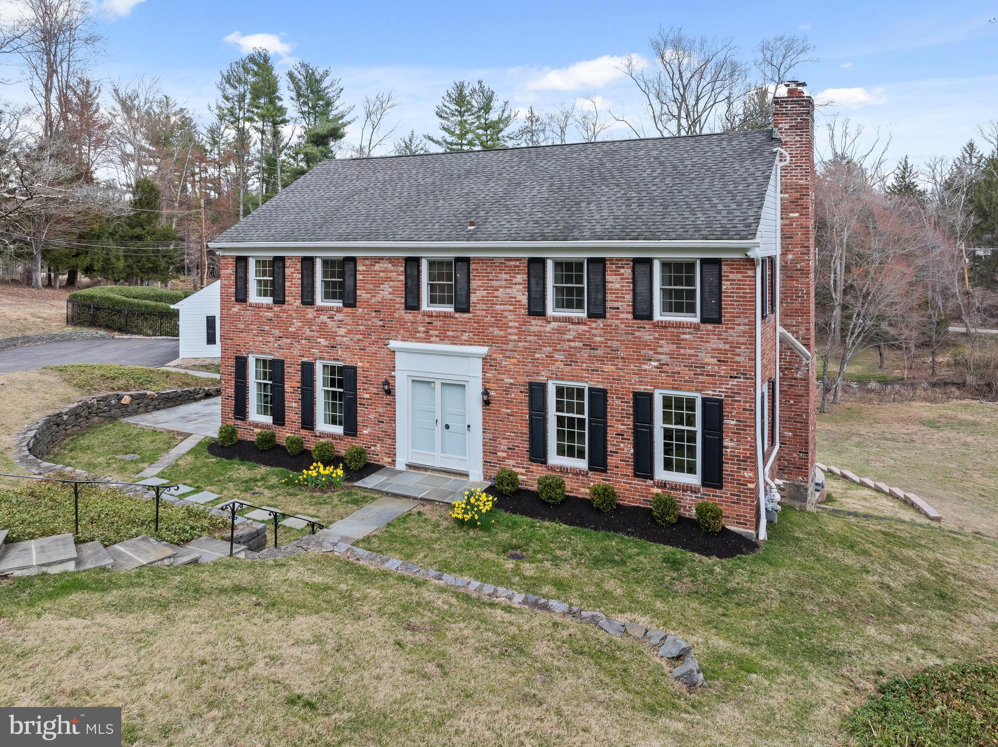 Welcome to 117 Adrienne Lane! Ideally located on a quiet cul-de-sac in northside Wynnewood, this pristine Classic Brick colonial home will be your private oasis! This beautiful 4 bedroom, 3 full/2 half bathroom quintessential Main Line home is situated on over one and a half acres of sprawling landscaped grounds on a private lane in Lower Merion Township. The plush greenery is highlighted with a flagstone terrace, and a large composite deck overlooking the gated glistening pool perfect for summer! The grounds are truly magical! As you enter the home through a double door front entrance to a center hall foyer, prepare to fall in love with this GEM! To the right, is an extra large formal living room complete with a gas fireplace, and extra large windows that drench this room with natural light. Adjacent to the living room, is an elegant formal dining room. The heart of the home is the updated kitchen with warm cherry cabinets, granite countertops and stainless steel appliances which opens directly into the breakfast room AND a large fireside family room addition with soaring vaulted ceilings, and an abundance of natural light from the large windows! The views from these windows overlooking the pool and the grounds are just spectacular! On the main level, there is also a bonus living area and a powder room! The second floor has a wonderful layout with four spacious bedrooms, including a primary suite with an updated en-suite bathroom with a shower. And there is another bedroom with an en suite bathroom, and two additional bedrooms served by a hall bathroom. The current owners conveniently added a washer and dryer on the second floor. The walkout lower level is super clean with epoxy floors, and includes an additional powder room, storage areas, additional laundry area (perfect for pool towels!) and a meticulous utility room featuring a newer tankless hot water heater and systems. The two car detached garage is also in mint condition, which also boasts epoxy floors. Gleaming hardwood floors run throughout the home. The interior of the home was just freshly painted, as well as many other notable improvements by the current owners including Elfa custom closets in two of the bedrooms. Please see the full list of improvements that is provided with listing documents. This home has been impeccably maintained by it's current owners with the intent that this would be their forever home, and they are only moving due to relocation. 117 Adrienne Lane is located in an ultra convenient location and situated in the award winning Lower Merion School District (Penn Valley Elementary, Welsh Valley Middle and Lower Merion or Harriton high school CHOICE zone.). Extremely central to the train and all major roadways making it a commuter's dream. Super close to shops, restaurants, Suburban Square, Whole Foods, Trader Joe's, Clubs, Parks, literally everything! This home comes with a whole house generator, and is completely "move in" ready! Style and beauty at every turn, make your appointment today!