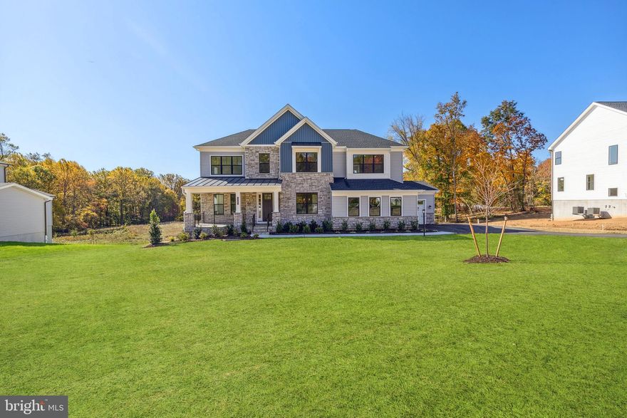 Immediate Move in! SFH, 4 bedrooms, 3 full baths & two half baths, 6,063 sq. ft., W/oversized 3 car-garage. Nearly an acre homesite, buffering to open space/conservation area on front and back great for privacy. Top rated schools, that are highly sought after, part of the coveted Centennial School District. Designer appointed features throughout, including stacking doors that open onto a large covered luxury outdoor living deck, W/fireplace and screen- great for entertaining. This open floor plan has an amazing chefs kitchen W/industrial grade Jenn Air SS appliances & large island, walk in pantry for all your cooking needs. Plus a cozy great room with fireplace,  two large dining areas, a bright study and bonus loft, will make this your forever home. There are oak stairs leading to the second floor primary bedroom that has a large walk- in closet and spa bathroom with shower and freestanding Kohler tub. Walkout basement has been finished to include a rec-room, half bath & wet bar rough-in. Extra windows were added to bring in even more light (Hardwood & tile throughout NO carpet!). Convenient to commuter routes in the heart of Ellicott City, minutes away from restaurants & shopping. Don’t miss out schedule an appointment today!