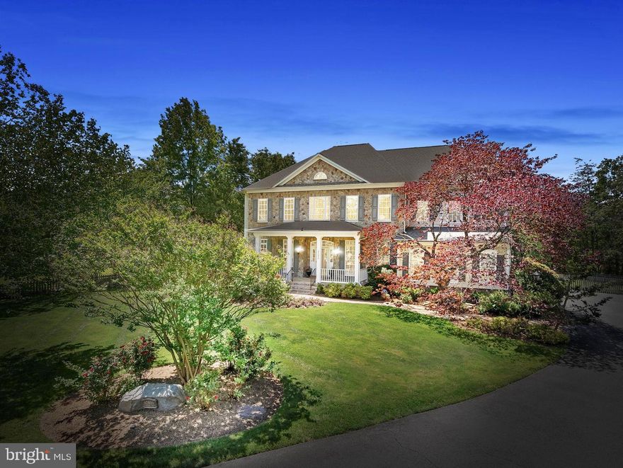 MULTIPLE OFFERS! Ready for a one-of-a-kind property in Beloved Broadlands? OPEN MAY 18th 1-3 PM! This unique private oasis is perfectly situated on a rare .61-acre lot with a saltwater POOL surrounded by mature trees.  The impressive North-East facing stone-front Thoreau model offers over 6,600 square feet of living space, 5 bedrooms, 4 full and 2 half bathrooms, first floor office w/custom built-ins, and a 3-car side-load garage w/EV charger and custom storage system.  The home’s outstanding curb appeal is highlighted by a custom flagstone walkway, professional landscaping, dramatic up-lighting and timeless front porch. New Roof: 2021! Inside, soaring ceilings, new designer paint and lighting, wood floors and new carpeting elevate much of the main and upper levels. The elegant foyer features a spiral staircase, paired with a second staircase off the kitchen for added functionality.
You’ll love the gourmet kitchen with NEW quartz counters, 6 burner WOLF stove,  double oven, stainless French-door refrigerator, and custom island with breakfast bar seating. There’s a spacious eat-in area with doors that open to the incredible screened porch overlooking the POOL (built in 2016)! The convenient mudroom with utility sink has a door leading to the pool which gives guests quick access to the half-bath! The adjoining 2 story family room features a striking stone fireplace and expansive windows that fill the space with natural light.
The luxurious primary suite boasts a gas fireplace, tray ceiling, cozy sitting room, two walk-in closets w/custom closet systems, soaking tub and separate shower, and designer lighting! Plus, the laundry room   is on the bedroom level for added convenience.  There are three spacious secondary bedrooms with two additional full bathrooms.  
The finished lower level features a spacious rec room, a dedicated home gym, and a "future wet bar area" with updated LVP flooring—rough-in already in place! Enjoy movie nights or the big game in the fully equipped home theater, complete with seating and components. A legal 5th bedroom, full bath, large storage room, and walk-up access to the beautiful backyard make this the ultimate space for relaxation and recreation.
Enjoy luxurious outdoor living with a spacious three-season screened porch, a stunning stone patio, and a dive-depth saltwater pool—perfect for relaxing or entertaining. While floating in the (heated) pool, you’re surrounded by trees and privacy!! The outdoor bar includes a beverage fridge and plenty of seating, while the large yard offers ample space for sports, play, and enjoying the privacy of your own resort-like retreat.
Zoned for the award-winning Briar Woods High School, Eagle Ridge Middle, and Mill Run Elementary—with both the elementary and middle schools within walking distance!
Incredible Broadlands Amenities with miles of walking/biking trails, 3 pools, multiple sport courts, community events, nature center, concerts and lots of tot lots! Plus close to the brand-new Ashburn Recreation & Community Center (coming late summer 2025).
Close to all major commuter routes, schools, dining, medical buildings, INOVA Loudoun Hospital, Dulles Airport, Dulles Greenway, Rt. 28 and Rt. 7. Only 2 miles to Silver Line Metro. It's like being on vacation in your own backyard -- this home has it all and is move-in ready! MUST SEE!