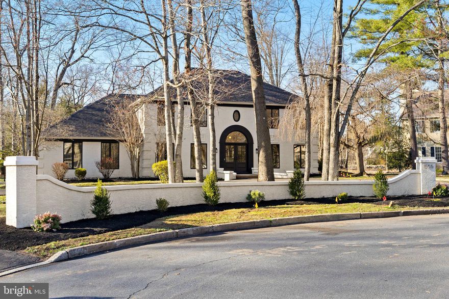 Look no further! This is the home you have been looking for! Completely renovated from top to bottom, this exquisite custom home is located on a cul de sac in a very tranquil neighborhood of Maple Glen. 4 bedrooms, 3.5 bathrooms, this 5657 square-foot masterpiece has been carefully redesigned from top to bottom where elegance meets contemporary sophistication.  Upon entering, you are greeted by a foyer adorned with a diamond checkerboard patterned custom limestone and Italian arabescato marble floor, leading to a curved white oak staircase with custom black metal railing—a true testament to the home's grandeur. From the foyer, the custom-built arched door opens into an office boasting gorgeous new built-ins with paneling on the walls and glass pocket doors opening up into a bonus room that is bright with natural light and windows all-around overlooking the outdoor swimming pool. The two story great room boasts an elevated raked walnut ceiling, complemented by custom-painted lime wash accent walls and a steel leathered granite fireplace, exuding warmth and style while providing full view of the gourmet kitchen. The completely renovated chef’s dream eat-in kitchen is equipped with top of line new stain steel appliances, a Viking 6 burner gas stove, double oven, in-drawer microwave, leathered granite countertops, beverage refrigerator as well a large island with quartz countertop,  plenty of cabinetry and space for a table for family gatherings.  Right off the kitchen, access to the two-car attached garage is available as well as a luxurious mudroom/laundry area designed with custom bluestone tile floors, white oak cabinetry, a dog wash station with custom handmade tiles, and a new GE Profile washer and dryer built into cabinetry and a full-light glass door with access to the backyard. Rounding out the main floor, the stylish dining room highlights a gorgeous custom ceiling and light fixtures that provide just the right ambience for family gatherings with the convenience of a butlers pantry newly built offering dual purpose as a desk and a completely updated powder room with terrazo flooring. Upstairs, the primary suite is a private retreat with two walk-in custom closets,  a luxurious bathroom that provides a massive walk-in tiled shower, “oversized freestanding soaking tub”,  a double vanity plus a water room. Three other spacious bedrooms and fully renovated hall bathroom with a stylish black penny-tiled shower complete the second floor. The finished basement offers endless possibilities for creating additional entertaining and/or recreation space and features an additional bonus room having access through French doors providing a closet and full bathroom for extra convenience, easily used as guest suite or 5th bedroom,   plus plenty of room for storage. Noteworthy features include premium European White Oak hardwood floors throughout, new solid doors with satin brass Emtek hardware, upgraded electrical systems, custom recess dimmable lighting through out, freshly painted, new doors throughout including new front door and new exterior doors. Outside the private outdoor oasis offers a large patio that overlooks the in-ground swimming pool and private backyard that allows for plenty of relaxation and entertainment for family and friends. This truly special designed home is located in the award-winning Upper Dubin school district and is close to public transportation while providing easy access to major highways and plenty of dining and shopping options.